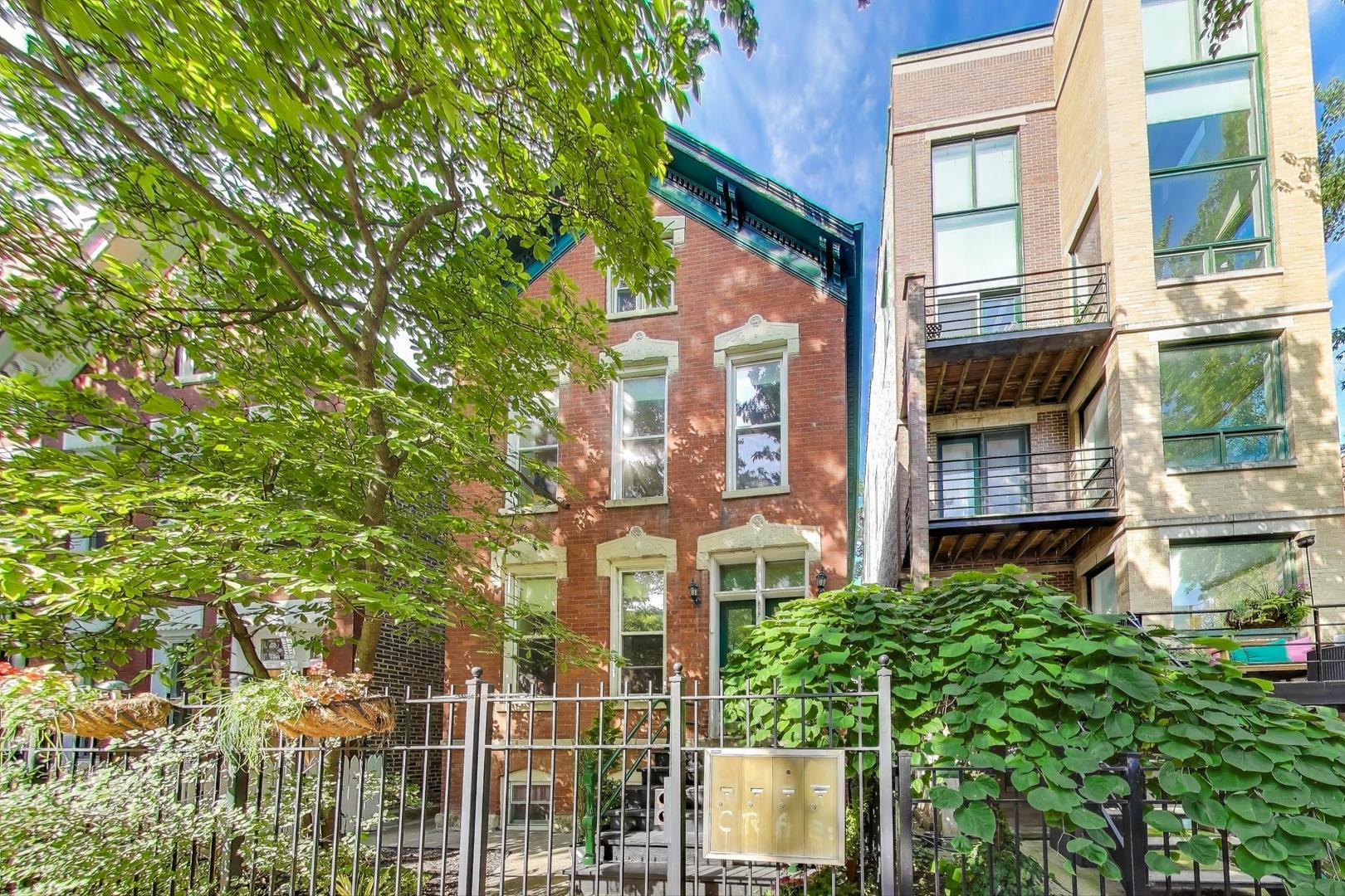 Welcome home to this beautifully updated 2-bedroom 2-bathroom PLUS den duplex up, nestled in the heart of the East Village Neighborhood.  This home features two floors of living space and two private decks including a custom-built cedar greenhouse. The main level contains a spacious bright family room that flows to the dining room.  The kitchen was renovated in 2023 with white shaker cabinets, granite countertops and stainless-steel appliances.  This home has great entertainment flow as the kitchen opens to the deck with room for a grill and dining table.    On this level you will also find the second bedroom, laundry closet and one full bathroom.  The upper level contains the sun-drenched primary bedroom with two skylights containing motorized shades, second full bathroom and access to the second private deck.  On this level there is also the custom-built greenhouse, a perfect space for year-round gardening, art and crafts.  Excellent work from home space with a large den that is currently being used as a third bedroom.  Prime tree lined street location with an 88 walk score and 92 biking score!  This property is steps from popular restaurants, shops, public transit (Blue Line, Division Bus, Ashland Bus, Chicago Ave Bus) and parks.  With countless updates and an unbeatable location, this home is truly a must-see!