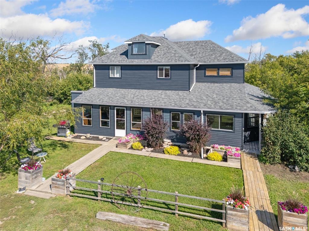 Welcome to the Waldner Acreage in the RM of Aberdeen.  This unique property is located just 8 km south of Aberdeen and has been lovingly maintained for many years!  With 5 bedrooms (including the loft area), and two bathrooms, this home can easily accommodate a growing family!   You can definitely envision some fantastic family gatherings in the open living and dining area. Adjacent to the kitchen is a spacious walk-in pantry and a laundry room! 32 by 6.5 covered deck to the East and a fully enclosed screen porch to the south, this home has amazing spaces to enjoy the quietness of rural living!  The lower level has tons of potential with 9 foot ceilings and access to outside from the basement.  There is a propane furnace, central air conditioning, central vac  and newer (2021) electric hw heater.  The shingles were replaced in 2019.  Please note:  the owners state that the original farmhouse (built in 1960), burned to the ground.  The current home was moved onto a new basement foundation in 1994.  This home was originally built in 1905 then gutted and moved to the current location.   This is an amazing property with a unique story!
