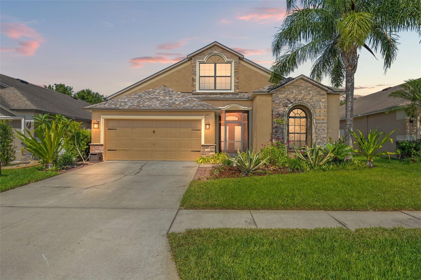 Welcome to 6631 Boulder Run Loop YOUR Private Retreat in the Heart of Oak Creek!

This beautifully updated 5-bedroom, 2-bath home offers the perfect blend of comfort, style, and peace of mind in one of Wesley Chapel’s most desirable communities.

From the moment you arrive, you’ll be welcomed by a screen-enclosed front patio that adds charm, keeps bugs at bay, and provides a cozy spot to enjoy your morning coffee. Step through the elegant double-door entrance and into a bright, open layout that immediately feels like home.

The primary bedroom is conveniently located on the main floor, while upstairs features a spacious bonus room the only room on the second floor making it perfect as a movie room, game room, or a private retreat.

Major updates include a NEW roof (2025), NEW A/C (2024), and 2022 appliances, including a sleek wine fridge. The entire home features professional window tinting, helping block the Florida heat, reduce energy costs, and provide added privacy with a reflective exterior finish.

Step outside to your fully fenced backyard with tranquil conservation views and no rear neighbors. Enjoy the Florida lifestyle year-round on your screened and covered lanai, complete with a spool the perfect combo of spa and pool for both relaxing and cooling off.

Freshly painted just two years ago, this home is move-in ready and located minutes from shops, dining, top-rated schools, and highways.

Don’t miss the opportunity to call this Oak Creek gem your own—schedule your private tour today!

This home is located about 15 minutes away from KRATE, 40 min north of Downtown Tampa, 45 min. from Tampa International Airport, and 80 minutes from Orlando and Walt Disney World. 
Don’t miss your chance to own this upgraded gem in Oak Creek—schedule your private showing today!