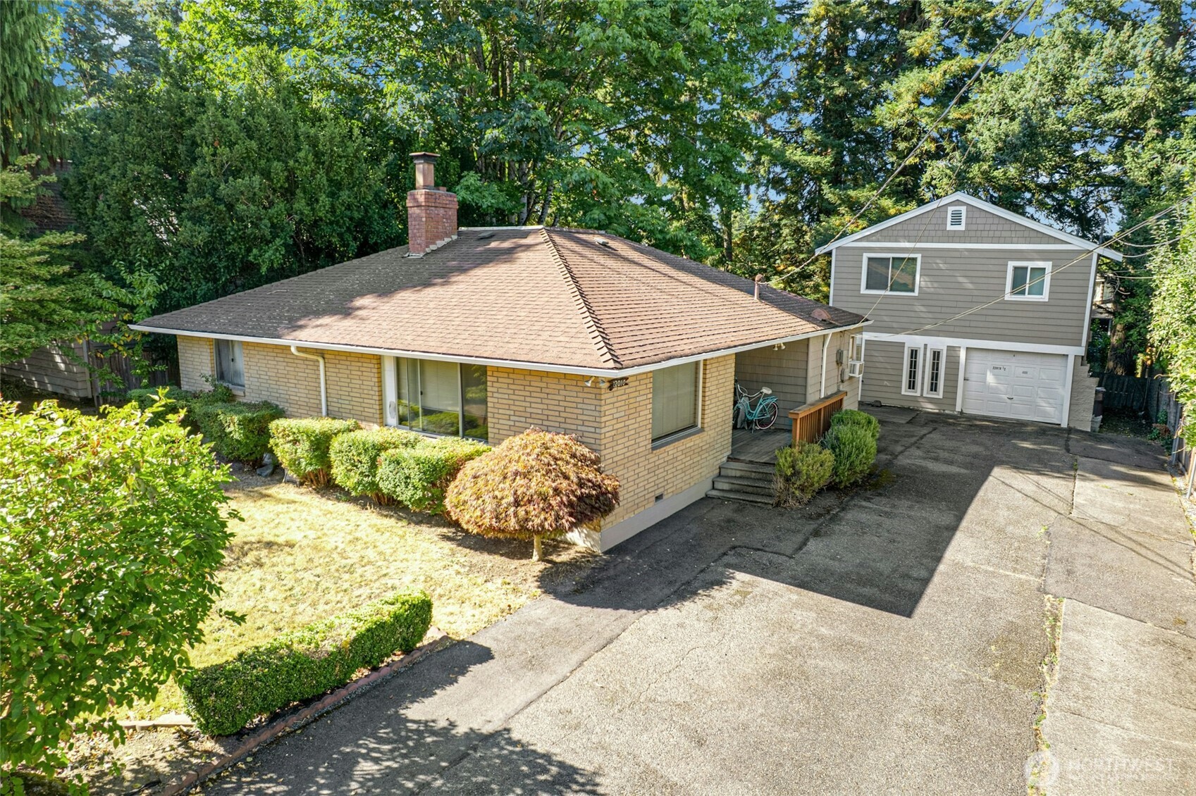 Tucked away off the main road, this secluded property offers a rare and unique opportunity in the City of Brier. Featuring two detached income producing dwelling units with separate addresses, the main home at 1307 square feet includes 3 beds, 1.5 baths, an updated kitchen and hardwood floors. The secondary, detached unit is a comfortable 506 square foot 1 bed, 1 bath in an open concept floorplan. Combined income is over $4000 a month! Individual laundry for both, 2 newer hot water tanks and plenty of driveway parking. Potential uses-keep as is with both units rented month to month, or owner occupied, or develop, you choose. With newer construction in the immediate area, the opportunity for future development is a distinct possibility.