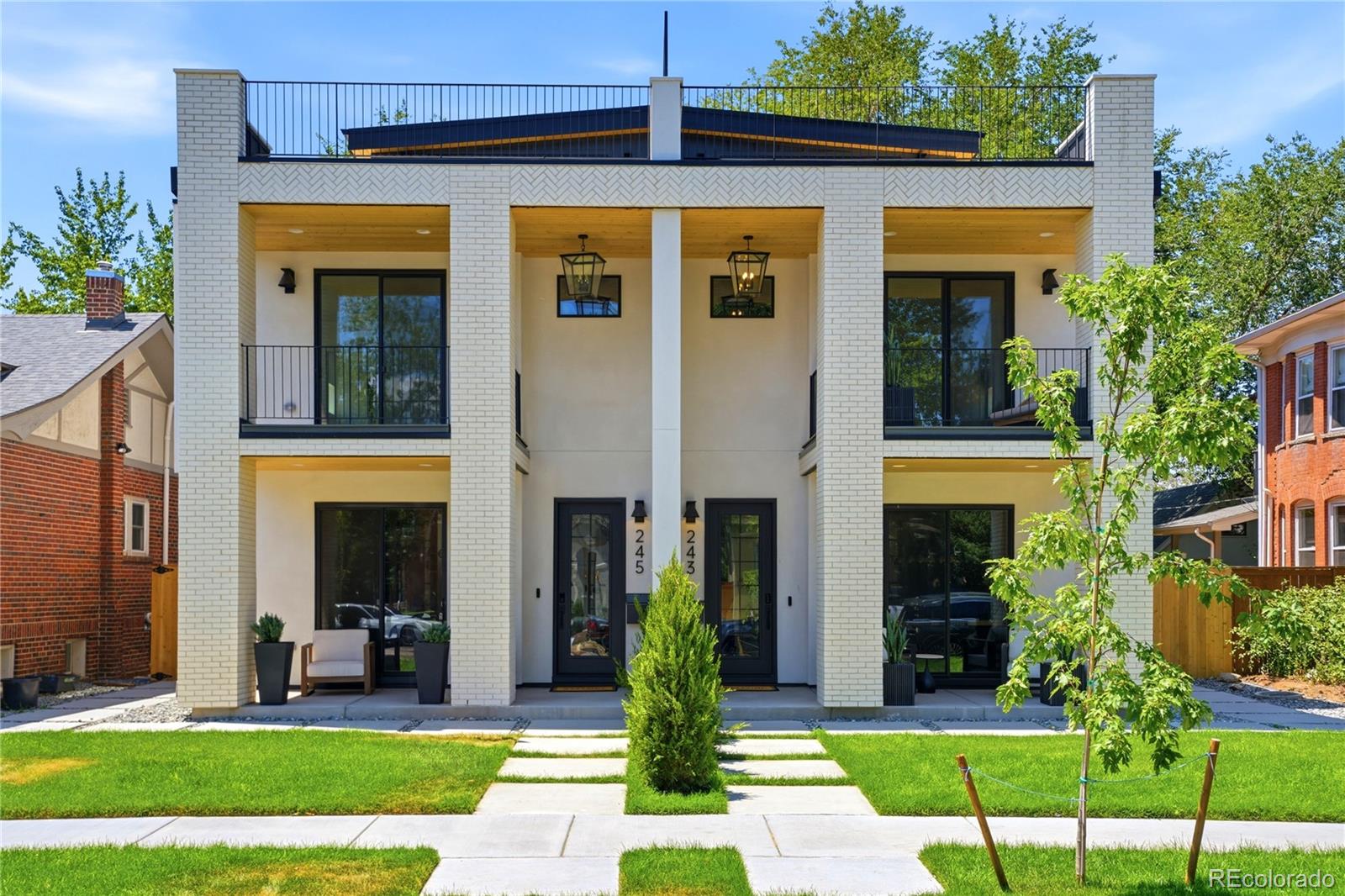 Just 4 blocks from Washington Park, this 2026 new-construction residence offers nearly 4,000 sq ft with 5 bedrooms, 4.5 baths, a private main-floor study/dining, loft, rooftop deck, large yard, and extra-height 2-car garage + 1 parking pad. Thoughtfully designed to live like a luxury single-family home, it features a wide, tall, light-filled floor plan with excellent separation and privacy across all levels. Stair placement on both sides creates a more open, functional flow than a typical residence.Main level features 9.5' ceilings, wide great room with architectural fireplace, chef’s kitchen with 9.5' quartz island, pot filler, professional range, paneled appliances, custom cabinetry, designer tile, dedicated mudroom, private study, and wide-plank hardwood throughout, including the lower level.Lower level features 10' ceilings, wet bar with dining, fireplace, spacious family/theater room, built-in speakers for 7.1 surround sound, setup for a 135-inch projector screen on the large TV wall, ensuite bedroom with wardrobe, dedicated laundry, and private exterior entrance.Primary retreat includes private balcony, custom built-in dressing closet, and spa 5-piece bath with LED-lit makeup mirrors. Top-floor bedroom with panoramic views. Loft with wet bar opens to a large rooftop deck with views. Set on a 3,550 sq ft lot with a large yard, extra-height 2-car garage, and parking pad. Additional features include ** 2 HVAC's , 2 laundry's, ** smart-home integration, built-in audio, security cameras, iPad control, enhanced insulation, energy-recovery ventilation, and performance-tested construction exceeding typical new-construction expectations.Walk to WashPark, neighborhood shops and Broadway. 5 min to Cherry Creek.  *** FLEXIBILITY -  Rare private side access and exterior entry to lower level complete with bar area, dish washer and washer/dryer.  Flexible space for guests, home office or extended family ***