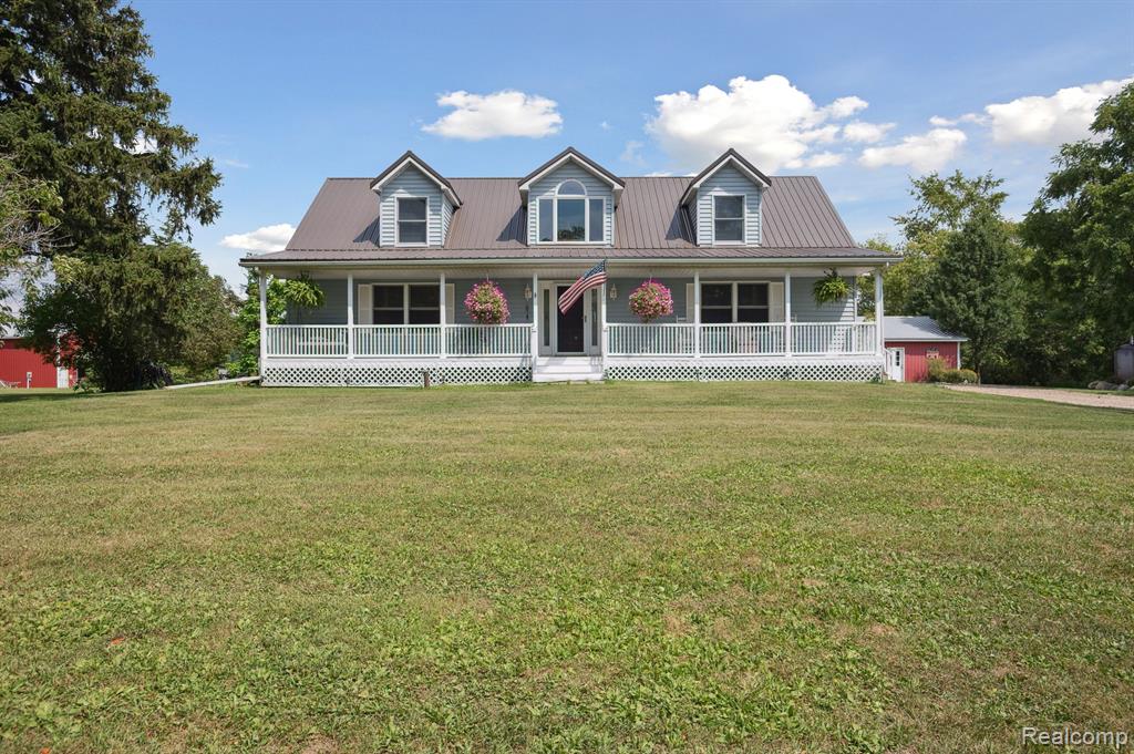 Nestled on 11.5 acres of picturesque countryside, this Cape Cod–style hobby farm offers a perfect blend of charm, functionality, and rural tranquility. The stately home features a full covered front porch that welcomes guests into beautifully appointed living spaces, including a formal dining room, family room with wood and tile flooring, and convenient first-floor laundry. The luxurious primary suite on the main floor includes a walk-in closet, separate shower, and jetted tub, while upstairs lies a bonus landing area surrounded by two sizable bedrooms and a full bath. Outdoor amenities are equally impressive—featuring an historic 1886 Amish-built barn, fenced pastures, and run-through stalls, making the property instantly ready for equestrian pursuits or small-scale farming. A three-car pole barn garage with dual roll-up doors provides exceptional workspace and storage. A relaxing back deck overlooks the land, complete with an above-ground pool and hot tub—ideal for unwinding after a day outdoors. Modern comforts are well-integrated, with both forced-air propane heating and an efficient gasification wood heating system, designed to reduce energy costs significantly. Additionally, the property presents opportunities for wildlife enthusiasts—trophy deer are frequently sighted on the wooded portions of the acreage.