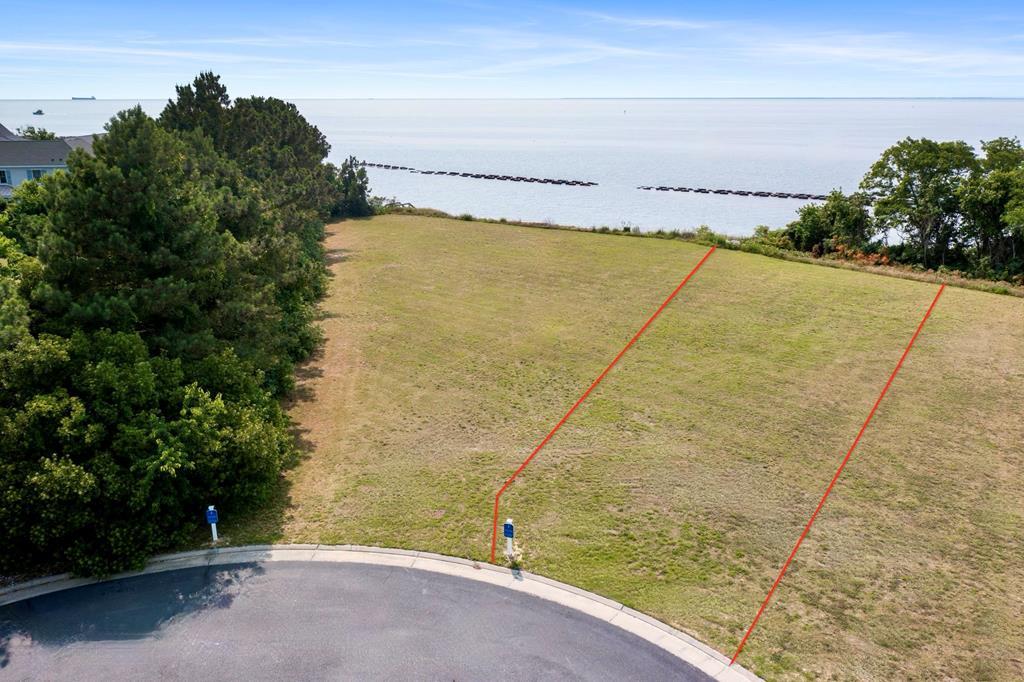 WATERFRONT HOMESITE! Located in The Colony neighborhood at Bay Creek, this property offers a rare opportunity to secure a true Chesapeake Bay homesite. With unobstructed views stretching across the Bay, this homesite is perfectly positioned to capture some of the most breathtaking sunsets on the Eastern Shore—an ever-changing backdrop of sunset colors and light that never gets old. There is no required timeframe to build, giving you the flexibility to design and build your ideal home when the time is right. Bay Creek's Builders Guild features a curated selection of trusted, high-quality builders who understand how to bring coastal luxury to life. Experience coastal lifestyle at Bay Creek were residents enjoy access to private beaches, resort-style pools, miles of scenic nature and preserve trails, and convenient access to nearby marinas. Waterfront homesites like this are becoming exceptionally rare in Bay Creek. Inquire about this homesite today!