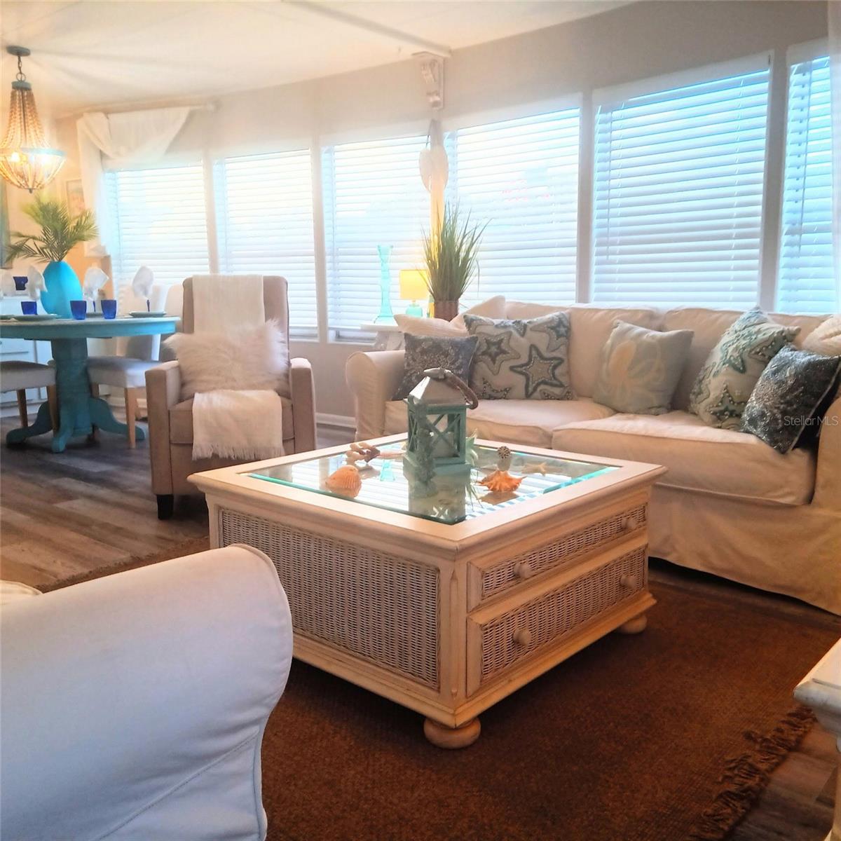 Welcome to paradise! Discover this beautifully updated, fully furnished double-wide mobile home in highly desirable Westwind Mobile Home Park in Dunedin, Florida. Situated on a desirable corner lot, this move-in-ready coastal retreat offers comfort, style, and an incredible Florida lifestyle. Even better, everything is included—from the furniture and linens to the pots and pans—making this home truly turnkey!Step inside to an inviting open floor plan featuring luxury vinyl plank flooring throughout the main living areas, fresh interior paint, new fixtures, faux wood blinds, and charming coastal accents. The updated kitchen shines with granite countertops, stainless steel appliances, a stylish backsplash, under-cabinet lighting, and a convenient pass-through breakfast bar with counter space on both sides and bar stools—perfect for casual dining and entertaining. The dining room also features a granite-topped hutch, adding both beauty and functionality.Both bedrooms are generously sized with abundant closet space. The primary suite is especially impressive, featuring three closets, additional storage for towels and linens, and a private en-suite bathroom with a walk-in shower. The guest bedroom includes a trundle bed, making it ideal for visiting family and friends. Both bathrooms have been tastefully refreshed with granite countertops, decorative backsplash, new porcelain tile flooring, and replaced shower valves.Practical upgrades add even more value, including electrical improvements brought up to code, vinyl siding, a metal roof-over, and an HVAC system approximately four years old. The water heater is approximately two years old.Outside, enjoy the beautifully landscaped corner lot, a private backyard patio perfect for relaxing, and a long carport with room for multiple vehicles. The spacious storage shed features a washer and dryer, a large laundry tub, and plenty of additional storage space.Enjoy the Westwind lifestyle! This active, friendly community offers two heated swimming pools, clubhouses, shuffleboard, recreation areas, and a calendar full of activities. The home is conveniently located just minutes from the beach, approximately five minutes from downtown Palm Harbor, and about ten minutes from charming downtown Dunedin, with its popular restaurants, breweries, boutiques, and waterfront attractions. Golf carts are permitted within the community.Best of all, this home includes an ownership share in the community, with monthly HOA fees of just $170, providing an ownership interest and a voice and vote in community affairs.Additional highlights:• Desirable corner lot with added privacy• Fully furnished and equipped for immediate enjoyment• Not located in a flood zone• Gated community access on one side• Community age requirements: one resident must be 55+, and a second resident may be 40+• Service and emotional support animals accepted, subject to applicable requirements• Rentals permitted for a minimum of three months, subject to community approval and background checksWhether you're searching for a full-time Florida residence, a seasonal getaway, or an investment opportunity, this beautifully maintained home offers an appealing combination of updates, convenience, and coastal charm.Pack your bags and start enjoying the Florida lifestyle! Schedule your private showing today.