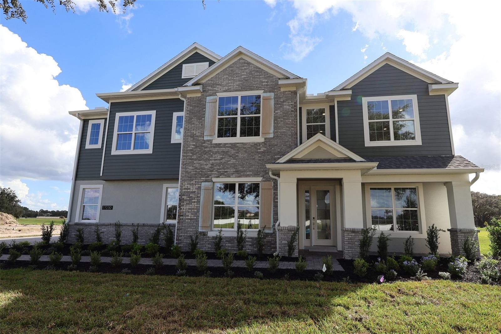 Under Construction. Located at 17030 Overstory Road in Orlando, this stunning new construction home is now for sale! This exceptional home features 5 spacious bedrooms including a first-floor guest suite, a first-floor den, a formal dining area, an open-concept living space, a spacious loft, a convenient second-floor laundry room, and more. This new construction home combines elegant design with practical functionality, offering generous room sizes and a layout that maximizes both privacy and shared living areas. The open-concept design creates a natural flow between kitchen, dining, and living areas, making this home ideal for both everyday living and special occasions. Located on the second floor, your owner's bedroom provides a peaceful retreat away from the main living areas, while the additional bedrooms offer ample space for family members or guests. With 4.5 bathrooms strategically placed throughout the home, morning routines will be streamlined and efficient. The second floor also holds the laundry room, spacious loft, and a lounge area.