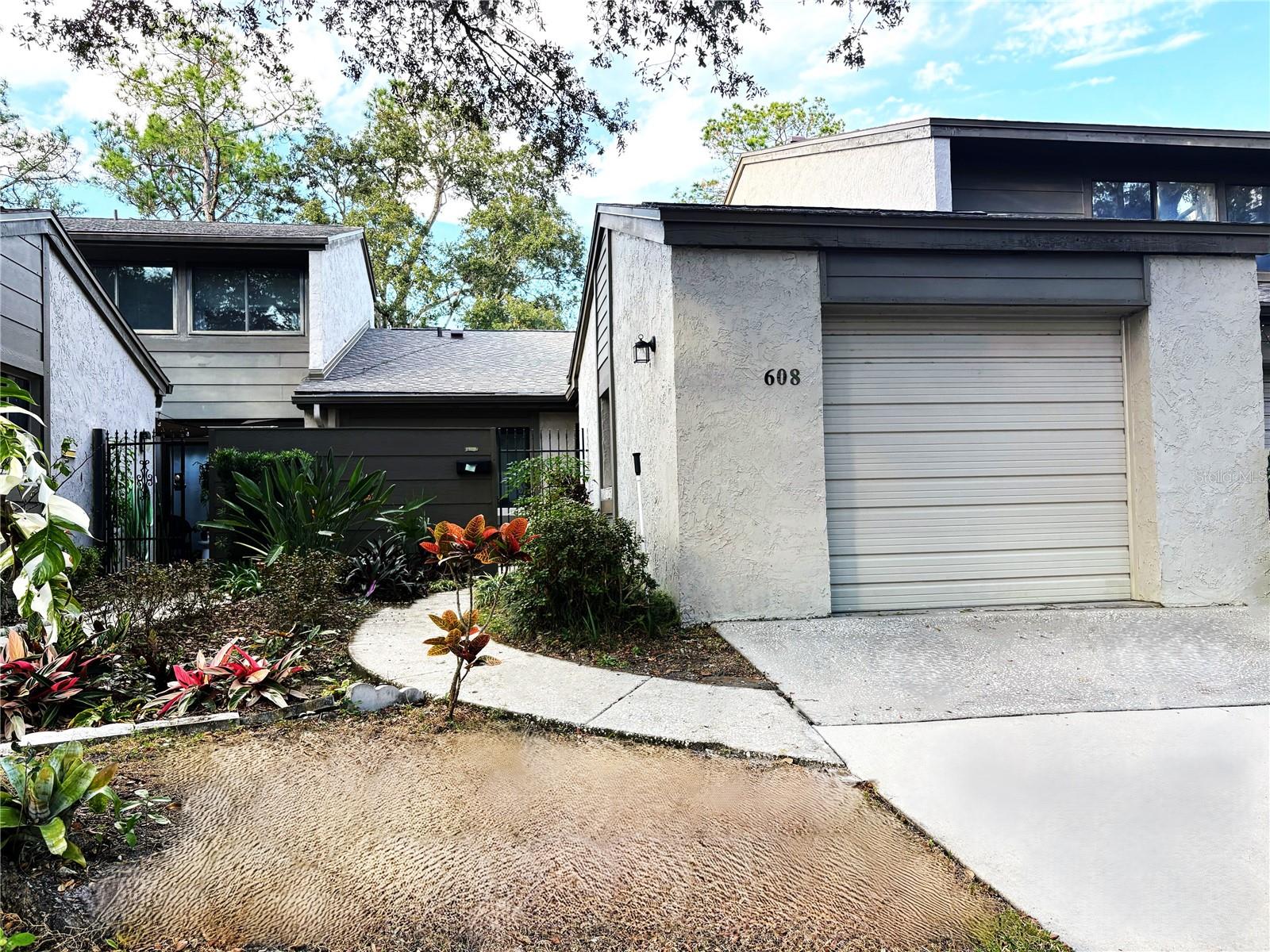 Under contract-accepting backup offers. Lake of the Woods 2 bedroom 2 bath townhome with 1 car enclosed garage. Private courtyard in front. Foyer with coat closet. Large Kitchen with newer appliances and eat in space. Spacious great room and formal dining room that is nice and bright. Big owners bedroom with walk-in closet, makeup vanity and new shower. Second bedroom has walk-in closet. Inside laundry closet with newer washer and dryer. Newer windows. Replumbed. New roof 2025. Newer sliding door. Hot water heater 2022. Low HOA dues. Community features POOL, tennis and basketball courts, fitness center, playground, picnic pavilion, community library, and fishing pier! Good schools. Great location. Move right in!