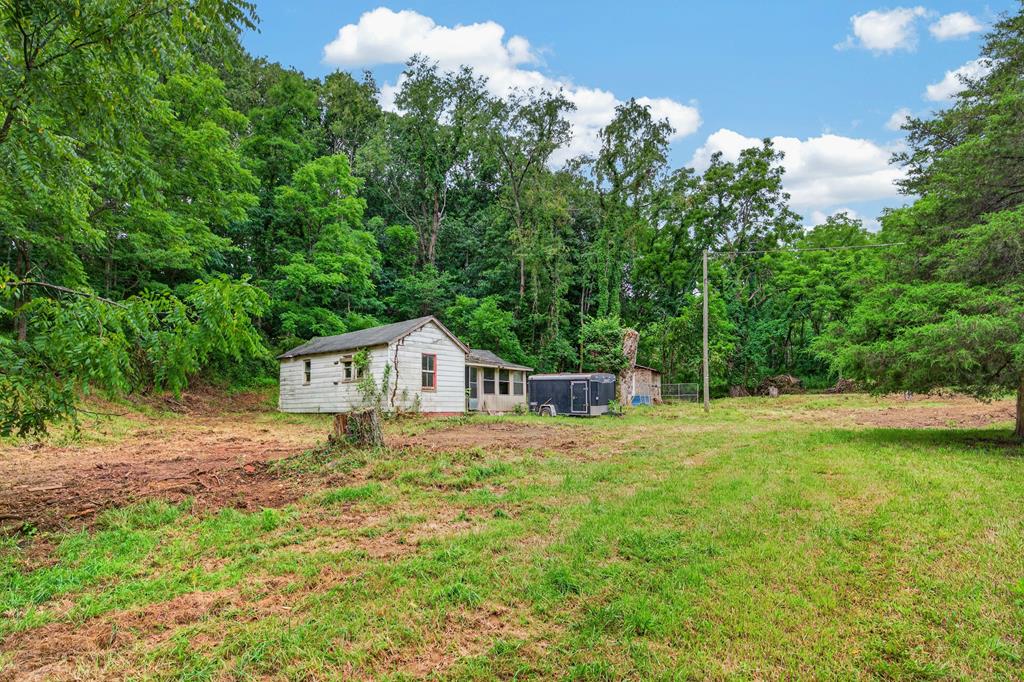 Opportunity awaits with this 0.76-acre property tucked away at the end of a quiet street. Featuring an older dwelling and additional building, this property offers plenty of potential for renovation, investment, or a future homesite. Conveniently located just off I-81 with easy access to downtown Pulaski, the New River Trail, and only a short drive to the Blacksburg/Christiansburg area, you'll enjoy a peaceful setting without sacrificing convenience.