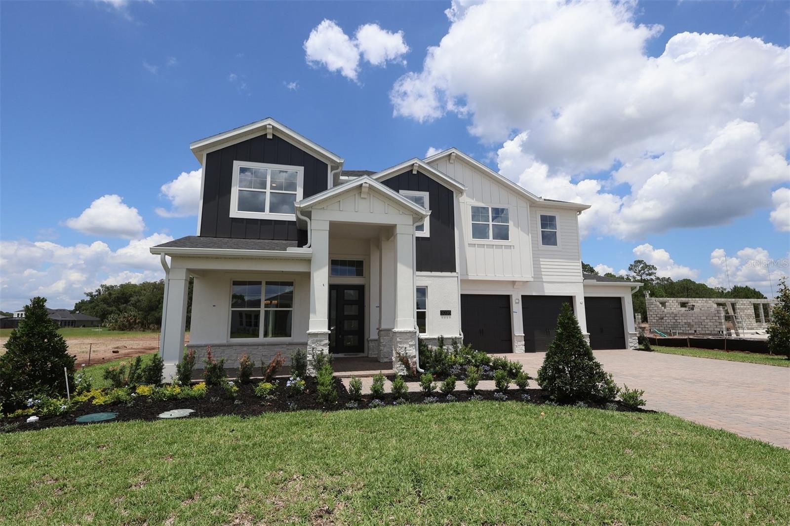 Under Construction. Welcome to 3035 Solace Way in Orlando, Florida — a stunning new construction home built by M/I Homes. This spacious 2-story home offers 4,977 square feet of thoughtfully designed living space, featuring 5 bedrooms, 4 full bathrooms, and 1 half bathroom. Step inside to discover an open-concept living space that creates a seamless flow between gathering areas, ideal for both everyday living and entertaining. The quality of design is evident throughout, with carefully selected finishes and attention to detail in every room.Both owner's bedrooms features a private en-suite bathroom, providing a comfortable retreat. The lanai and balcony extend your living space outdoors, offering a perfect spot to unwind. Key Features:- 5 spacious bedrooms across 2 floors- 4 full bathrooms and 1 half bathroom- 4,977 square feet of living space- Open-concept living space for comfortable entertaining- Two owner's bedroom with private en-suite bathrooms- Walk-in closets for every bedroom- Covered lanai and balcony for outdoor relaxation- Oversized 3-car garage This home is situated in a welcoming neighborhood with convenient proximity to parks, making it an excellent choice for those who enjoy outdoor recreation and green spaces. The surrounding area offers a pleasant environment with well-maintained walkways and easy access to nature.