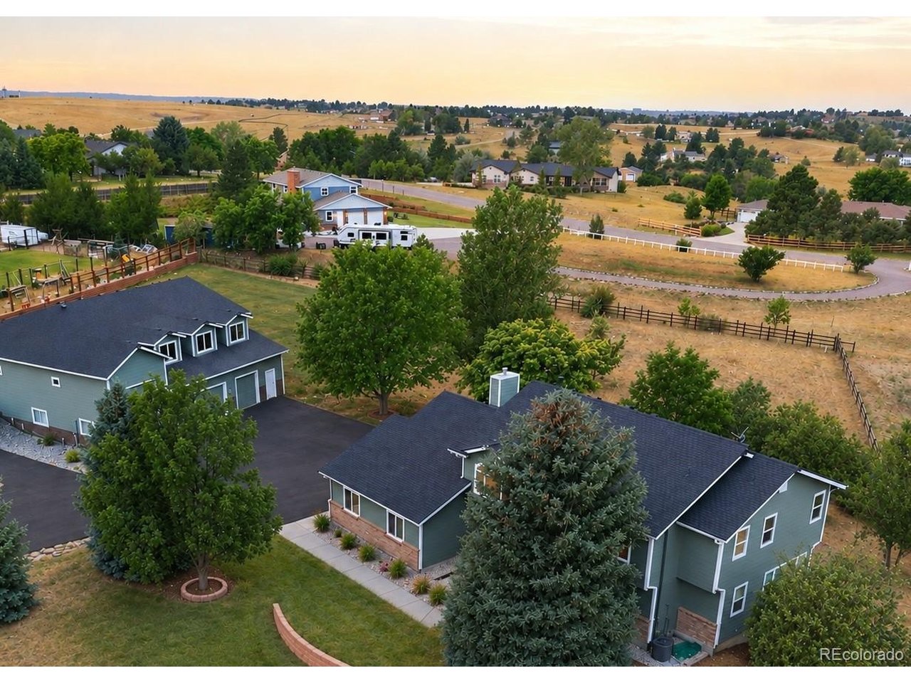 Beautifully remodeled in 2026, this 4,233 sq. ft., 5-bedroom, 5-bath home sits on 2.1 fully fenced acres in SE Denver Metro with beautiful sunrise and sunset views. Updates include new bathrooms, flooring, countertops, windows and more. Vaulted ceilings in the family room and primary bedroom add to the spacious feel. Two kitchens, including one on the walk-out lower level, provide flexibility for entertaining, guests or multigenerational living.An Entrepreneur's or Car Collector's Dream! The true showstopper is the custom-built, two-story detached garage/workshop. Built in 2019, it offers approximately 4,100 sq. ft., easily accommodating up to 8 vehicles with workshop, equipment, storage or business-related space. Includes 1,524 sq. ft. of open second-floor space with endless possibilities for an office, studio, play-space, workspace or storage.Enjoy generous RV/motorhome parking with a newly paved driveway. All this conveniently located near E-470, Parker and Arapahoe Roads, Southlands Mall, shopping and dining. A rare combination of a beautifully remodeled home, acreage and extraordinary garage/workshop space!