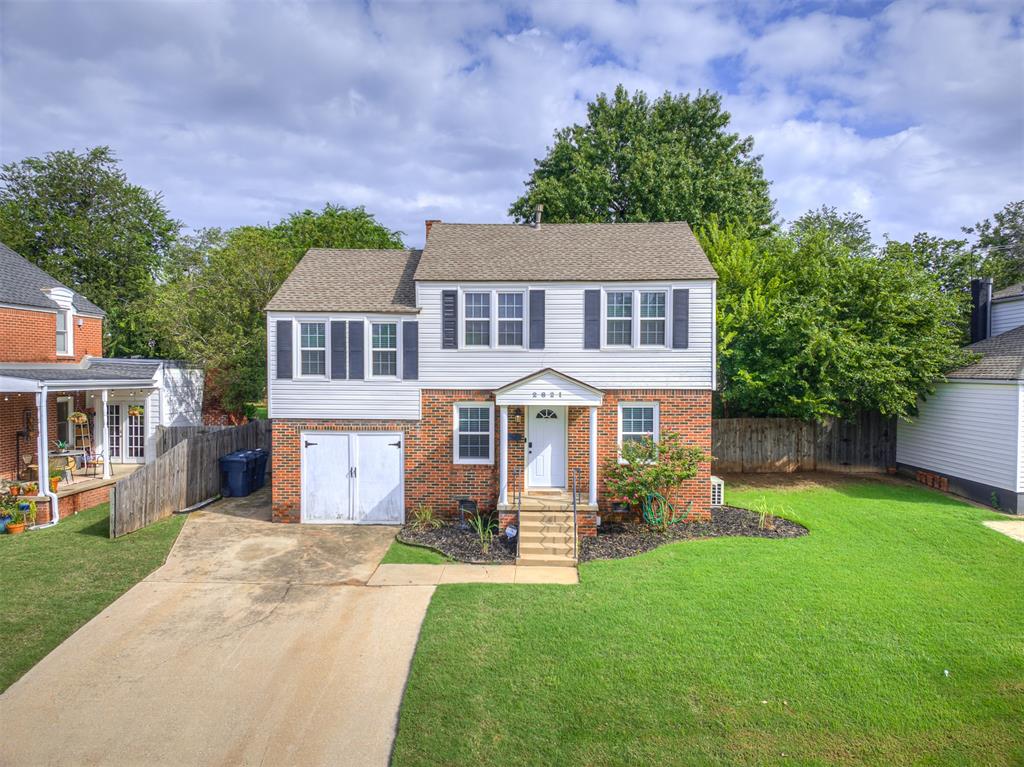 Charming 3-bedroom, 1.5-bath Colonial-style home featuring 1,571 sq. ft. of living space on an 8,820 sq. ft. lot. Built in 1946, this beautifully maintained home offers a welcoming multi/split-level layout with a decorative fireplace, ceiling fans, and fresh paint woodwork. The kitchen comes equipped with a dishwasher, disposal, free-standing gas oven, and gas range. Enjoy outdoor living with a spacious deck, fire pit, and storage, all complemented by a combination fence for privacy. Additional highlights include central heating & air, brick & frame construction, and an outbuilding for extra storage. Convenient concrete parking and a versatile layout make this property ideal for comfortable living and entertaining.