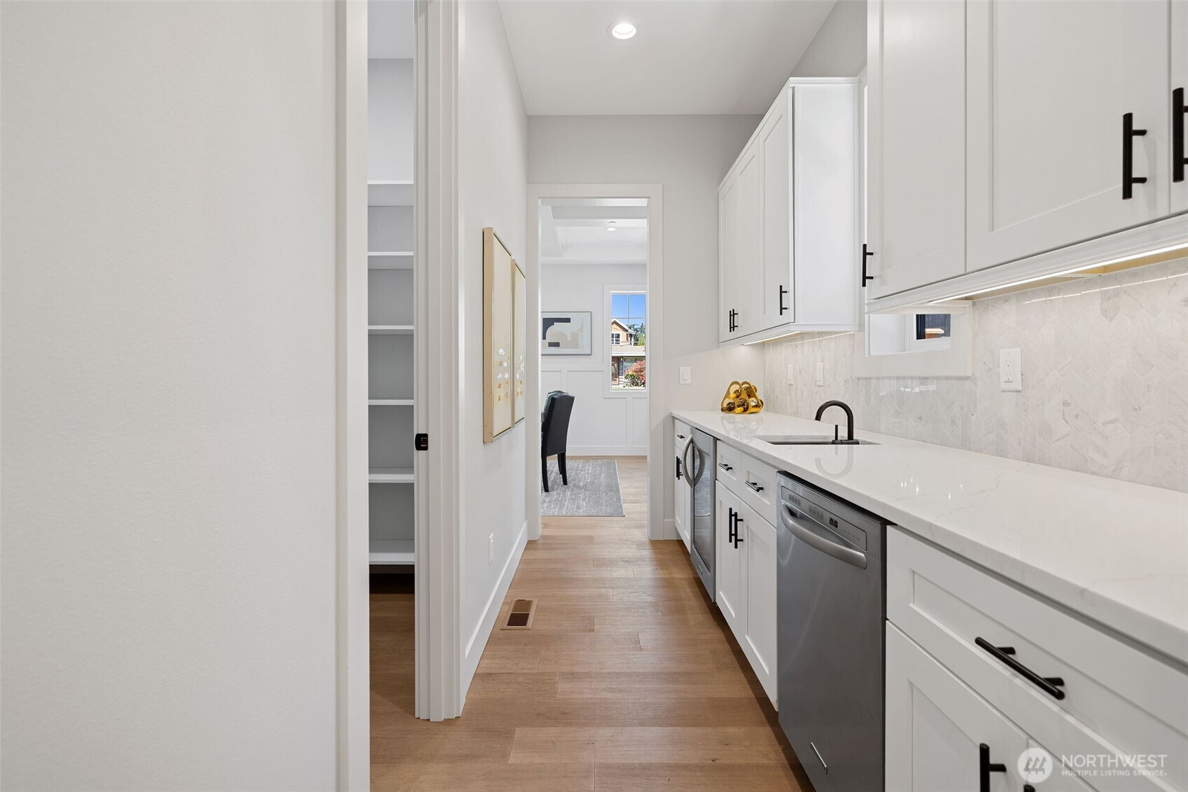 Butler's Pantry connecting Formal Dining room and Kitchen. Walk-In Pantry entrance from BP.