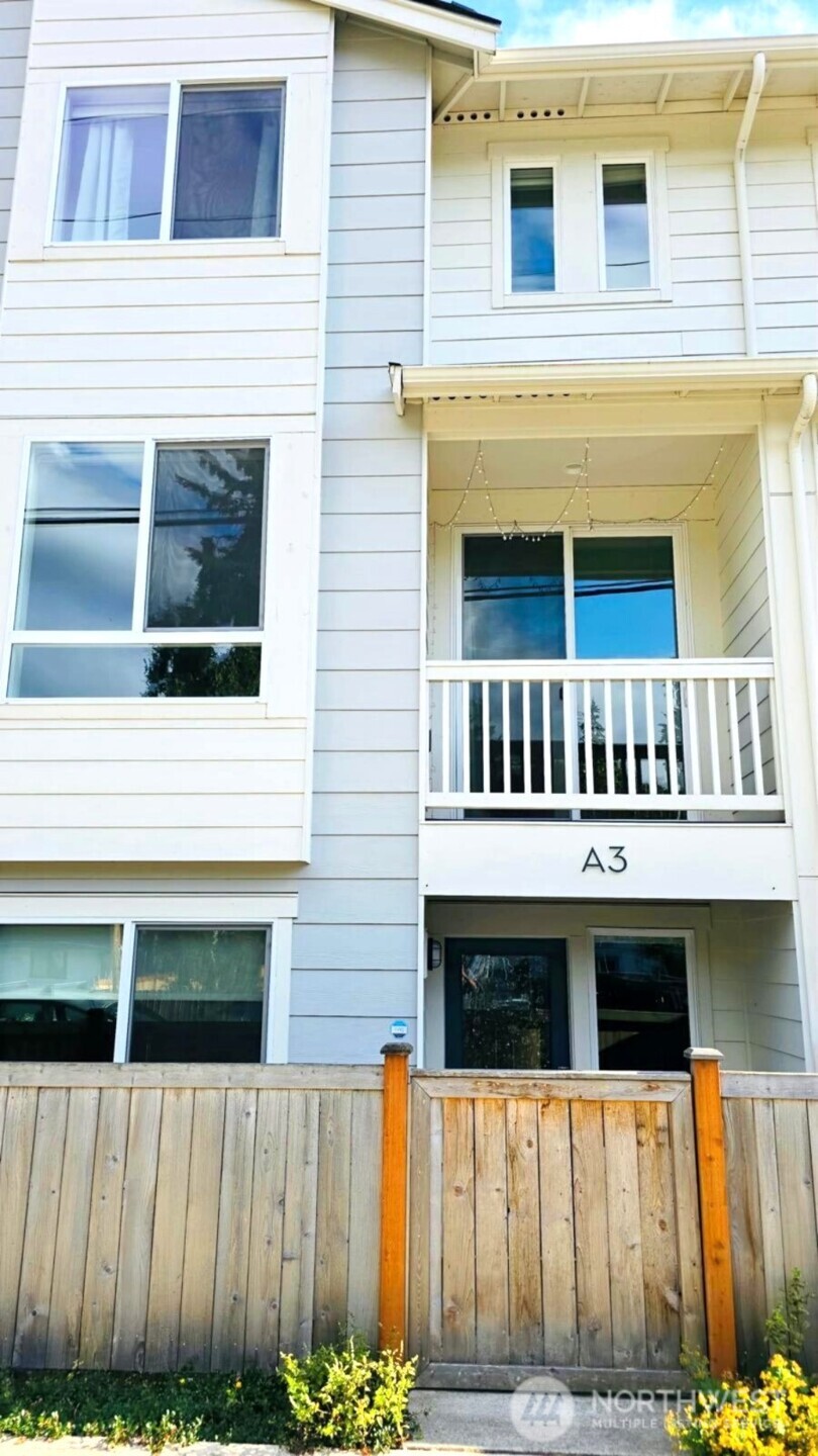 Welcome home to this contemporary townhome in the heart of Edmonds, offering effortless access to both I-5 and I-405. This beautifully appointed 4-bedroom, 3-bathroom residence features an open-concept main floor bathed in natural light, complete with a covered deck off the living room, perfect for year-round outdoor enjoyment.  The designer kitchen is a showstopper, boasting an oversized island, quartz countertops, and stainless steel appliances, all flowing seamlessly into the dining area. A versatile pocket office adds everyday functionality, while wide-plank flooring lends warmth throughout. The north-facing home stays comfortable in every season with A/C in the living area and primary bedroom.  Thoughtful upgrades include Ring sensors and motion detectors for peace of mind, upgraded plumbing fixtures, and stylish white roller blinds throughout. Step outside to a fully fenced and landscaped yard, plus a convenient 2-car side-by-side garage. With low HOA dues, highly rated schools, and unbeatable proximity to gyms, shopping, dining, daycare, and light rail, this home delivers the perfect blend of comfort, convenience, and modern style.  Pre Inspected! Virtually Staged! A MUST SEE!!!  USE OUR PREFERRED LENDER TO RECEIVE A 1-0 TEMPORARY RATE BUYDOWN ON YOUR MORTGAGE, POTENTIALLY SAVING YOU THOUSANDS IN YOUR FIRST YEAR OF OWNERSHIP!