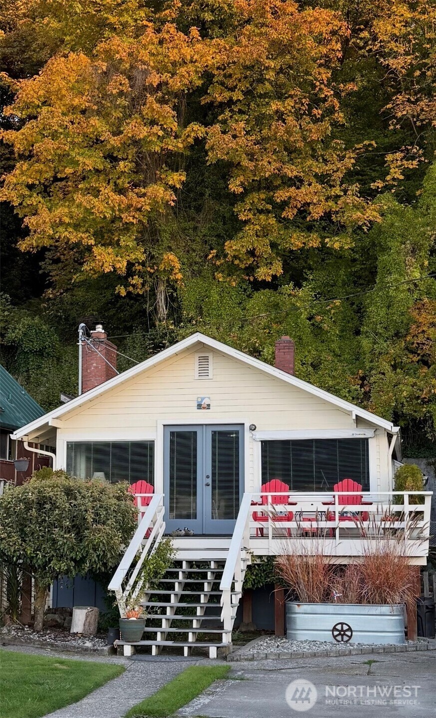 This charming waterfront beach cottage faces due West! Enjoy sunset dinners on a rare over-the-water deck. Drive up to this lovingly maintained 2 bedroom, 1 bath cottage with all the amenities of a well appointed home, suitable for year round living. Recently remodeled kitchen with SS appliances, dishwasher, quartz counter top and tile backsplash. Stay cozy all winter by the wood burning fireplace. Spend summers on the decks surrounded by the sweet scent of jasmine. In-home washer and dryer and full bathroom with lots of storage. Beautiful original hardwood floors. Parking for 4 cars. Paved driveway and fenced yard with fire pit. Two sunny decks! Beach walking at low tide can’t be beat. Launch kayaks from the neighboring sandy beach.