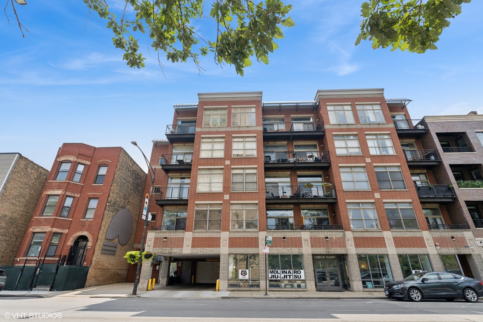 Spacious 2bd/2ba condo located in an intimate elevator building in the heart of Lakeview! Enjoy direct access to the exclusive oversized 500 sq ft patio just off the main living area-perfect for entertaining, relaxing, or unwinding on warm summer evenings. The open-concept layout features soaring 12-foot concrete ceilings, newly installed luxury vinyl flooring, and an upgraded kitchen with granite countertops, newer stainless steel appliances, and a large dining area. The generous primary suite offers an ensuite bath with marble double vanity. The second bedroom is very large and offers ample storage. Both bedrooms are fully enclosed. Recent updates include: new AC, in-unit washer and dryer, and patio door. Attached heated garage parking is included, along with additional storage by the parking spot. Unbeatable location just steps to the lake, Brown and Red Line, restaurants, shopping, and vibrant nightlife!