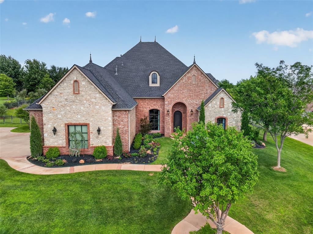Luxury living awaits in gated Summit Lake Estates, a picturesque community with multiple ponds. Built in 2007 and set on a beautifully landscaped property, this stately brick-and-stone home offers 4,158 square feet, 5 bedrooms, 4 full baths and a 3-car garage. Rich architectural details include arched openings, extensive millwork and beautifully refinished wood floors(10/25) throughout the entry, main living area, both dining areas, primary suite and study/fifth bedroom. The spacious great room showcases a striking stone fireplace and opens to a chef-inspired kitchen with an island, commercial-style gas range, double ovens, abundant cabinetry and exposed-brick accents. The private primary suite features a tray ceiling, spa-like bath with dual vanities, soaking tub, walk-in shower and generous closet. Two remodeled secondary bedrooms (2025) including updated LED lighting and a remodeled Jack-and-Jill bath(2025). Upstairs provides exceptional flexibility with an expansive bonus room/optional 2nd living area, bedroom and full bath—ideal for guests, recreation or a private retreat. Outdoors, enjoy resort-style living with a saltwater pool and spa, covered patio, outdoor kitchen beneath a pergola, outdoor wood burning fireplace and sweeping lawn. Extensive improvements include both HVAC systems (2024), garage doors and openers(3/25), New pool panel with surge protector(2025), water heater(9/25 in garage), New pool panel and surge protector(2025), smoke/CO detectors(9/25), septic installed new disconnect, whip & 20 amp breaker(4/23) also 2 - 1 1/2 riser on ATU & pump tank(11/23), lighting, plumbing fixtures, and freshly painted patio(5/2026), 2 light fixtures by doors on outside backyard patio and 2 motion detector cameras by garage/pool equipment(10/23). Refined, spacious and designed for memorable entertaining.