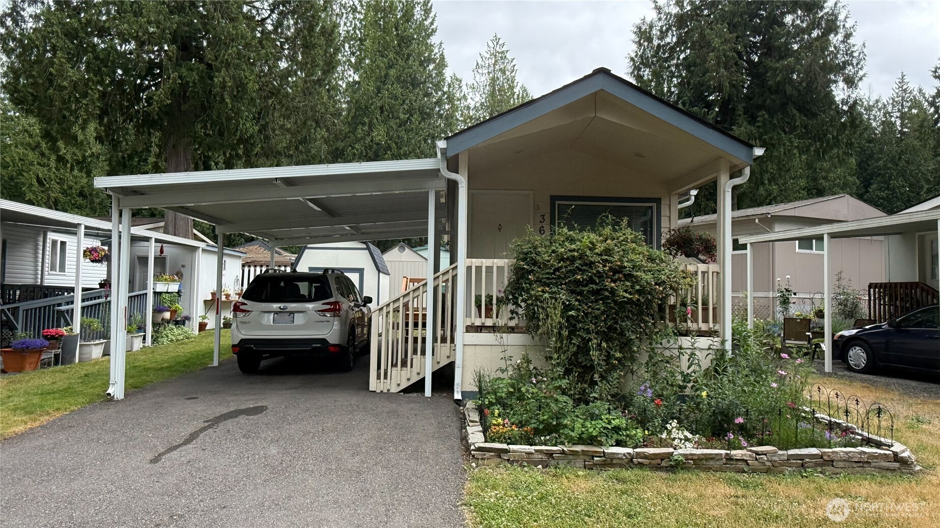 Welcome to serene living at Tiger Mountain 55+ Community! Nestled among the trees, this well-maintained 1 bed/1 bath home offers the perfect opportunity for quiet & simple living. Enjoy a private, peaceful setting w/ a covered porch, ideal for relaxing outdoors. The spacious lot also features covered parking & storage shed. Comfortability year-round w/ a heat pump providing both heat & A/C. All appliances are included, making this home move-in ready. Located just minutes from downtown Issaquah, you’ll enjoy easy access to shopping, dining & freeway access while benefiting from a quiet, nature-inspired setting. Space rent of $1,000 includes water, septic, garbage, & yard maintenance. Park approval required. Showing appt only. NO DRIVE-BY's!