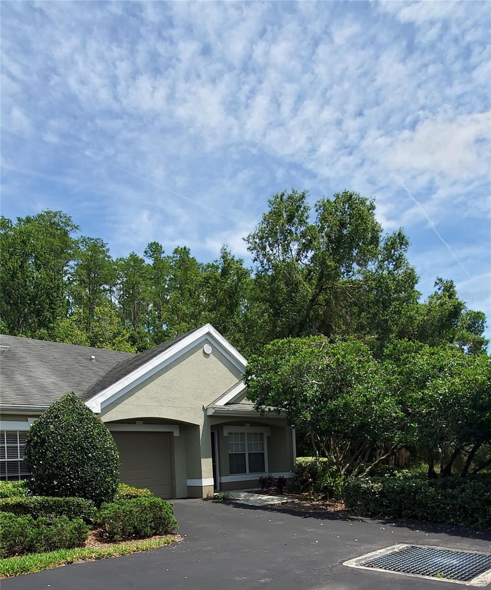 This one bedroom PLUS DEN villa with a garage is an end unit with conservation and/or pond view from every window. Its location at the edge of the complex on a huge pond provides the ultimate privacy. The condo has an open kitchen and living room with a separate dining room. Lots of light from large windows and a screened porch overlooking a wooded area. The community clubhouse has a pool & spa, gym, library/study room and a rec room. There are also grills and picnic areas, a carwash and a playground for the little ones in this beautifully maintained gated East Lake community.