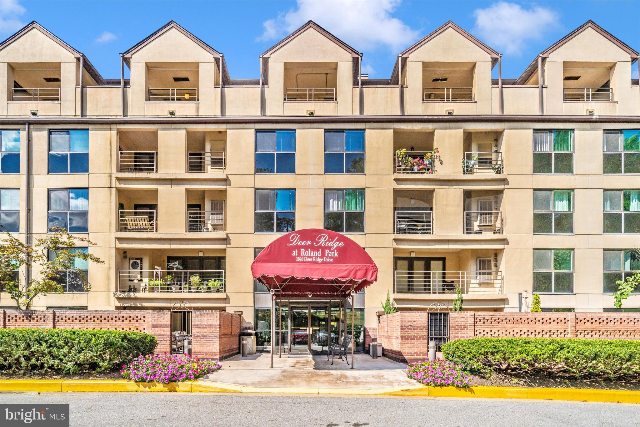 Discover this rare two-level penthouse in the heart of Roland Park. This spacious 2-bedroom, 2.5-bath condominium combines modern style with everyday comfort, featuring soaring 2-story vaulted ceilings, abundant natural light, and multiple balconies for indoor/outdoor living. From the balconies, enjoy breathtaking sunsets—arguably among the best in the city.The main level offers an open layout anchored by a wood-burning fireplace with a sleek slate hearth, luxury vinyl tile flooring, and a chic powder room. The updated kitchen shines with stainless-steel appliances, ample cabinet space, a striking mirrored backsplash, and elegant granite countertops.Gorgeous and plush brand-new carpeting leads you upstairs, where a versatile loft/office overlooks the living area. This level also offers a full laundry room and two generously sized bedrooms, each with access to a spacious balcony—an ideal spot to unwind while enjoying the serene, park views. Life at Deer Ridge is remarkably quiet and tranquil; surrounded by mature trees, it hardly feels like you’re in the city at all. The expansive primary suite boasts 2 large closets with built-in shelving and a private bath retreat with toilet closet and jetted tub.Additional highlights include modern recessed LED lighting throughout, two deeded garage parking spaces, and an extra storage closet on the lower balcony. With stylish finishes, thoughtful updates, and a coveted Roland Park location, this penthouse truly blends comfort, convenience, and sophistication.(photos virtually staged)