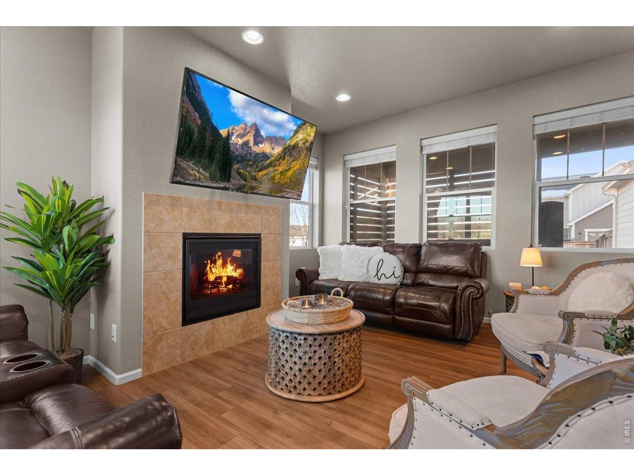 This beautifully designed 4-bedroom, 4-bath home is in wonderful, almost-new condition and offers comfort, space, and modern style throughout. The open floor plan features a large kitchen with granite countertops, tons of cabinetry, and generous prep space, flowing into the living room with a cozy gas fireplace. The main level showcases LVP flooring and a welcoming covered front entry. Enjoy a fully fenced backyard and private enclosed back patio. Upstairs includes three bedrooms, a versatile loft, and a spacious primary suite with a 5-piece bath, vaulted ceilings, and walk-in closet. A 2-car garage adds convenience while situated nicely on a corner lot. Ideally centrally located near grocery stores, coffee shops, and biking trails. Truly a move-in ready home!