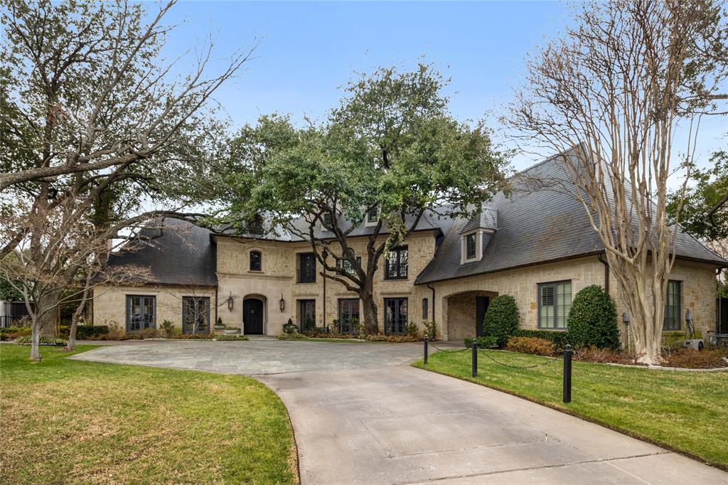 Located in the heart of Old Preston Hollow, this gated French-inspired estate sits on beautifully landscaped grounds just under an acre, offering privacy, scale, and timeless architecture. Originally built in 2002 and extensively renovated approximately ten years ago under the direction of renowned designer Gonzalo Bueno, the home blends classic design with refined, updated interiors. Spanning over 11,000 square feet, the residence features expansive living areas, a vaulted formal entry, private study, and a chef’s kitchen that opens to the family and keeping rooms—creating an ideal setting for both everyday living and large-scale entertaining. The first-floor primary suite offers a private retreat, with additional ensuite bedrooms, media room, and game room providing flexible living spaces throughout.The outdoor environment is designed for recreation and relaxation, featuring a resort-style pool, manicured grounds, and a newly added private pickleball court. A separate guest house, located across the pool, includes a bedroom, living area, and office—perfect for extended stays, work-from-home needs, or private accommodations. A gated motor court with four garage bays completes this exceptional offering.