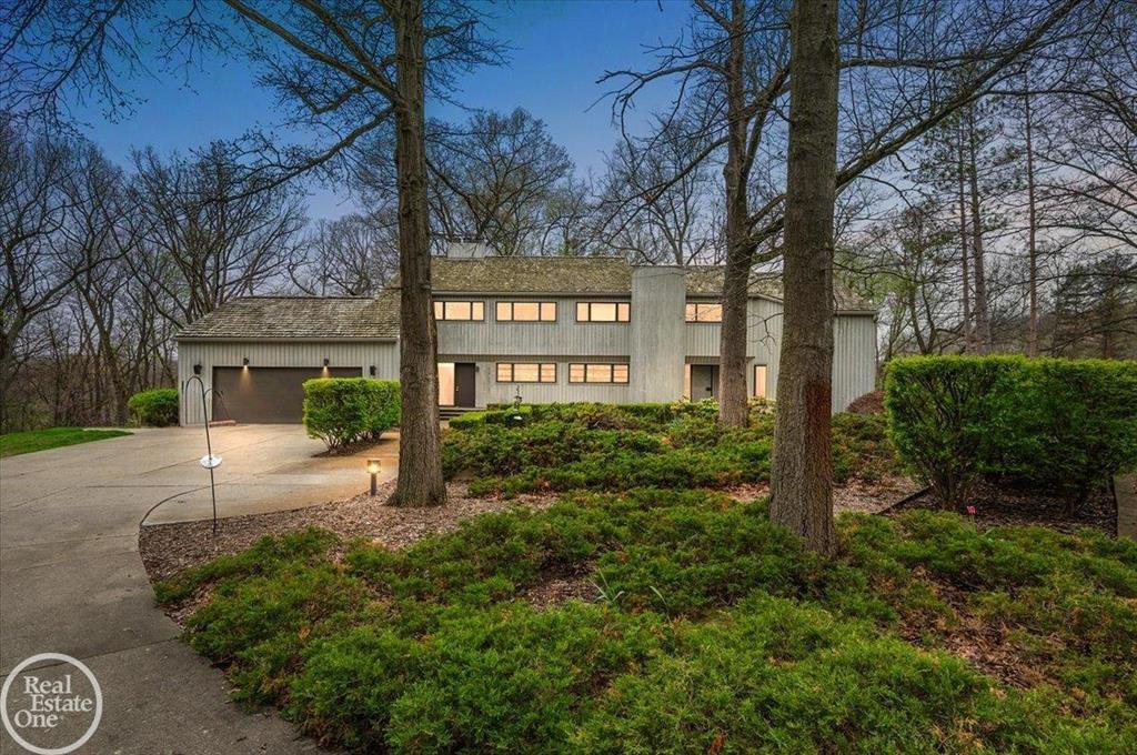 Once in a lifetime location! Custom built contemporary home designed by renowned architect Carl Luckenbach. This custom home is sitting high on a hill overlooking a spectacular 37-acres of rolling majestic forest and the Paint Creek. Property currently consists of 48 acres with the lower 11 acres being dedicated as a nature preserve; Property has potential to have 3-4 additional estate size building sites overlooking this rolling wooded property. There is over 900ft of frontage on the paint creek. The original owner has maintained this home in exceptional condition; features expansive windows in every room that offer views that have to been seen and can't be imagined; Large great room with vaulted ceilings and exposed wood beams; Sunroom with panoramic views opens to large deck leading to stairs that walk down to scenic pond; Large barn with electric-gas-water & 4 horse stalls- fenced pasture & fenced paddock. A distinctive property in the heart of Oakland Township.