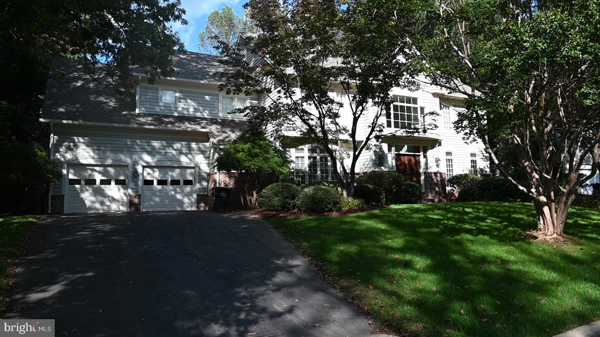 Stunning Gulick Cambridge Model! Welcome to this gorgeous home. From the moment you enter the bright two story foyer and see the dramatic staircase, it is clear that this home is something special. The main level features a spacious living room, quiet office with built-ins, large family room with gas fireplace,  large dining room and great kitchen. The laundry room is located  on the main level. Head upstairs to find 4 large bedrooms (2 sharing the Jack-and-Jill bath and one with its own bathroom). The 5th bedroom, the Primary Suite, is exceptionally luxurious with its well-propotioned space, plentiful closets and updated adjoining bathroom.  The lower level features a second family room, a bedroom with an access/egress window, a media room and an exercise room. There is a full bathroom on this level and tons of storage. The garage is oversized for two cars and has ample additional storage. Out back, is a lovely composite deck and a travertine walkway up to additonal yard. The location is amazing! Close to Route 7, near walking paths, pools and tennis courts, shopping and metro. Just minutes to Dulles Airport and Reston Town Center. Photos should be available 3/18.