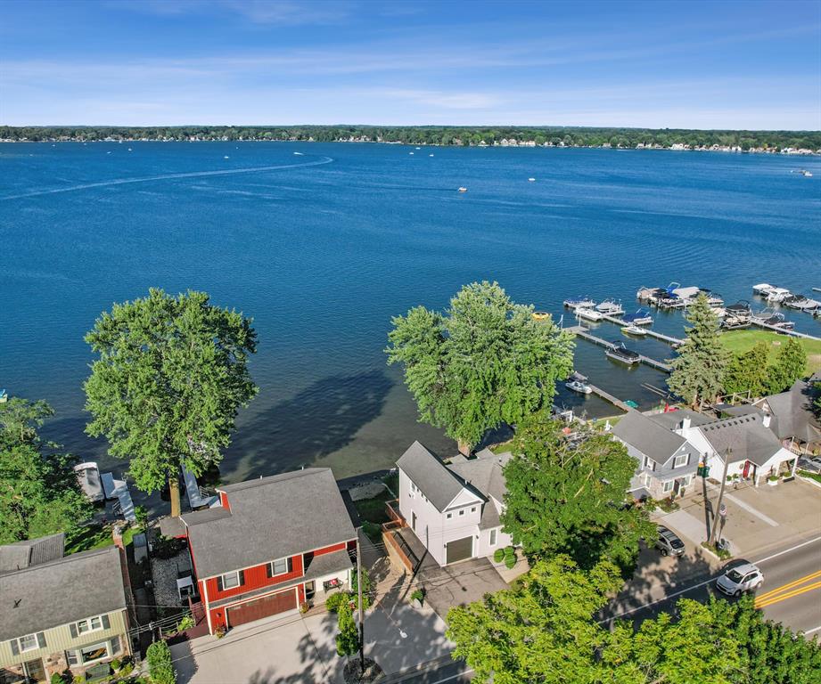 The BENEFIT of this Whitmore Lake Waterfront Treasure...The BENEFIT of this Whitmore Lake Waterfront Treasure - Updated Improved Well-Maintained Historic Home... Located in Whitmore Lake, this home offers direct private all sports lake access with panoramic views of Whitmore Lake. Situated on an excellent lot with easternly views, sandy beach, and walkable to downtown Whitmore Lake, this home offers everything you desire in a lakefront living.  3 bedrooms (one is situated in a way that offers a very private master suite, quest, or in-law quarters), 3 Full Baths, walkout basement, attached garage with service door, driveway allows spaces for at least 3 more vehicles, large deck spanning entire width of home, patio, extra parking pad, and so much more.  The updated craftsman like finishes provide a warm cozy feel to the already comfort of lakefront living.  Originally 100-year-old plush hardwood flooring is in impeccable condition and complemented by the many updates and improvements.  All appliances included, newer Lennox furnace with Wi-Fi controls, and multiple A/C units for zoned comfort.  You will be able to move right in and start enjoying the much sought after lake life. The serenity of the water and sunrise views from many rooms throughout the home, yet easy access to highways for elegant dinners out.  Whether in downtown Ann Arbor or Brighton, these nearby areas are just 10 minutes away.  Do you like to entertain?  Nothing like a party on the lake.  Be the place to celebrate all occasions; birthdays, holidays, University of Michigan Games, Tigers, Lions, Redwings, Pistons and more.  Whether you plan to live the lake life year-round, enjoy your up north cottage yet only minutes away, or use the house as an investment property, this is the perfect property for any option.  While the super clear spring fed all sports lake is outstanding during the warmer months, Whitmore is also great during the winter months where you can enjoy skating, organized hockey, ice fishing and more.  You have found a rare opportuni