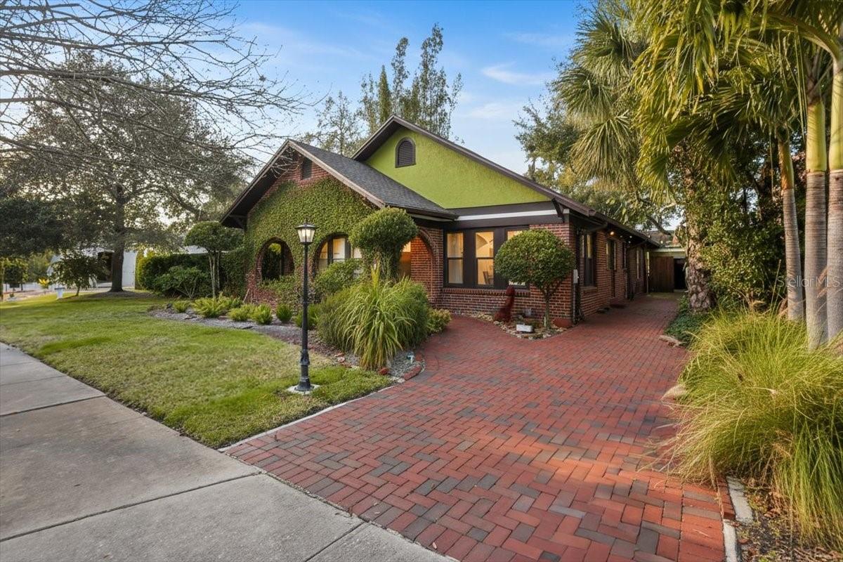 Under contract-accepting backup offers. Welcome to 2313 W Bristol Avenue- an extraordinary offering in Parkland Estates set on a rare EXPANSIVE 100 x 125 DOUBLE LOT — a truly distinctive home in one of South Tampa’s most sought-after neighborhoods, offering an exceptional combination of a tranquil and private retreat in the vibrant heart of the city, just steps from Howard Ave., Hyde Park Village and Bayshore Blvd.Framed by mature landscaping, ivy-kissed brick, and a charming arched entry, this home immediately sets itself apart. Inside, rich engineered hardwood floors, graceful archways, expansive indoor and outdoor living spaces, and thoughtfully layered design elements create interiors that feel curated rather than commonplace. Natural light fills each room, highlighting architectural details and inviting gathering spaces.The renovated kitchen blends timeless materials with bold style, featuring marble countertops, a substantial center island with gas cooktop, stainless steel appliances, and custom cabinetry — all seamlessly connected to the surrounding living and dining spaces. The space functions beautifully for both daily living and elevated entertaining.A formal living room anchored by a white brick gas fireplace offers warmth and character, while the impressive 30 x 17 great room—with dual three-panel sliding doors—opens to a screened and pavered outdoor retreat. Complete with a 2025 pool house, this private oasis provides an exceptional setting for entertaining or relaxed outdoor living.A versatile room with custom built-ins offers flexibility as a home office or additional bedroom. Two generously sized secondary bedrooms feature beautifully appointed en suite baths with designer finishes. The primary suite serves as a serene sanctuary, complemented by a spa-inspired bath with glass-enclosed shower, refined tilework, and elevated details. Just beyond, a tranquil backyard setting with a waterfall and koi pond enhances the home’s sense of retreat.Recent improvements include a new roof (2025), extensive updates completed between 2017 and 2022, a well-maintained HVAC system with ductwork in place for a potential second unit, and numerous thoughtful upgrades throughout.Light-filled, yet rich with character, refined yet expressive, this is a rare opportunity to own a home that offers architectural distinction, privacy, and premier walkability in the heart of South Tampa! LOT HAS BEEN APPROVED TO BE SPLIT INTO TWO 50 X 125 LOTS. POOL HOUSE HAS VARIANCE TO INCREASE SIZE.