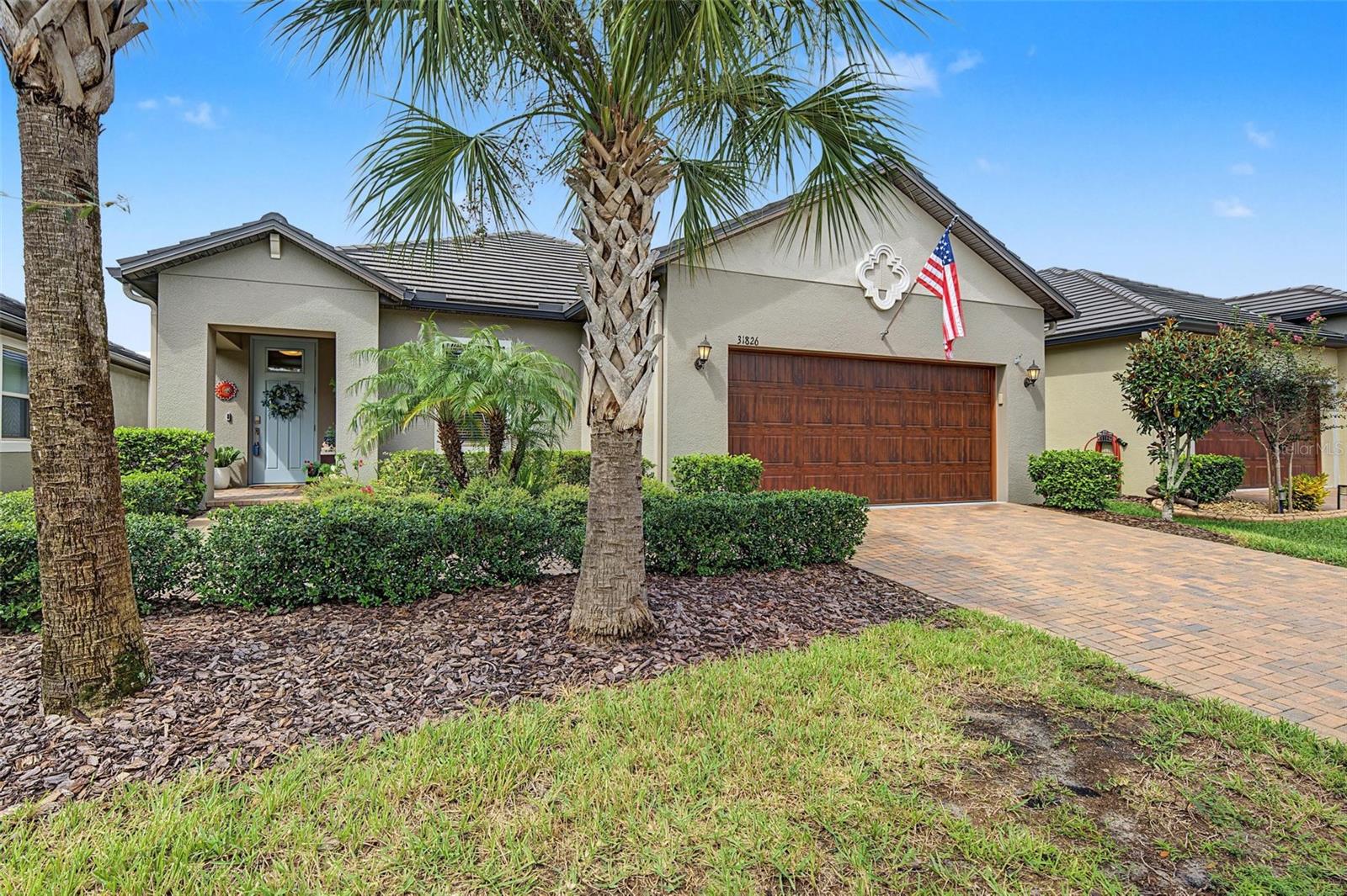 FULLY FENCED HOME in Medley Active Adult for those better than 55 years young presents an exceptional lifestyle just beyond the confines of your home. As a resident, you'll enjoy exclusive Clubhouse access with a full calendar of events daily! You will also enjoy a grill & bar, heated pool w/cabanas, ballroom, billiards room, card room, state of the art fitness center, pickleball & tennis courts, bocce ball, yoga, line dancing and private active adult events. PLUS included in your HOA is a 15-acre lagoon membership w/soft, sandy beaches including a swim-up bar, kayaking, paddleboarding, obstacle course, waterslides, corn hole games, and tons of community events! Be sure & invite friends or family to come along with you as you may gift them passes or pay a deeply discounted rate! There is also a BRAND NEW TIKI HUT COMING SOON along with another set of amazing amenities! This LOVELY home will please even the most selective buyers! Comprised of 2 spacious bedrooms, 2 full baths, OFFICE/DEN/CRAFT ROOM, and 2 car garage w/ ADDITONAL STORAGE SPACE or room for a larger vehicle OR GOLF CART. THE OVERSIZED GARAGE ALSO HAS PULL DOWN STAIRS AND ADDTIONAL FLOORING ADDED FOR EXTRA STORAGE. THERE ARE ALSO SEVERAL HANGING STORAGE RACKS IN THE GARAGE! Your new home has lots of natural lighting, GRANITE THROUGHOUT, stainless appliances and abundant cabinetry. Sliding glass doors lead to your lania and FULLY FENCED backyard. As you step inside, you'll be greeted by a seamless flow of open living spaces, making it ideal for both relaxation and entertaining. Get ready to make memories that will last a lifetime! Your dream home awaits, you will be enjoying the CAREFREE FLORIDA RESORT LIFESTYLE in your new home as quickly as you are able to move in! Gorgeous curb appeal on this FULL BLOCK HOME with INSULATED GARAGE DOOR on your oversized garage for your convenience. Enjoy 42" Cabinets, and Walk-in Pantry in this gorgeous kitchen. Primary Suite includes ensuite bath, dual sinks, and Walk-in Closet to keep you organized, ceiling fans, GRANITE & TILE FLOORING is included in this energy efficient home. WATER SOFTENER & GUTTERS HAVE BEEN ADDED FOR YOUR CONVIENENCE. High-speed (ULTRAFI) internet, premium cable, yard maintenance & exterior painting are covered by HOA. The location of this residence is equally remarkable. Situated in close proximity to premier shopping destinations, and an array of dining options, you'll find yourself immersed in a vibrant community that strikes a perfect balance between exclusivity and convenience. Ride your Golf Cart to the Clubhouse, Publix, restaurants, Farmers Market and more right inside the neighborhood! Close to Advent Health Hospitals, BayCare Hospital, Florida Medical Clinic, Wire Grass Mall, Tampa Premium Outlet Mall, Krate at the Grove, Sam's Club, Costco, Golf Courses & Movie Theater. Easy access to I75, 275, Tampa International Airport, Downtown Tampa and Florida's amazing beaches. CDD IS ALREADY INCLUDED IN TAX AMOUNT.