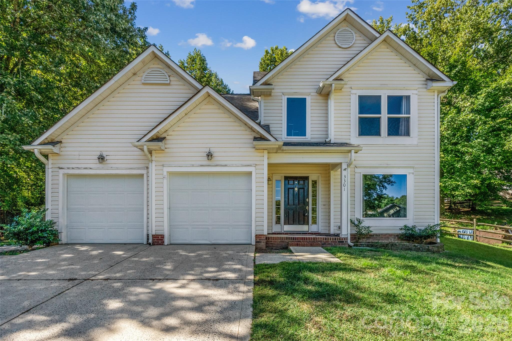 Welcome home to 3301 Rillet Court, tucked at the end of a quiet cul-de-sac in the established Farmington neighborhood. The main level is made for everyday living and easy entertaining, with laminate and vinyl plank flooring, a kitchen with a gas cooktop, and a family room where the fireplace sets the tone for cozy evenings. A separate dining room gives you flexibility as a formal dining space, home office or second living area. Upstairs, the primary suite has its own full bath, joined by two more bedrooms with walk-in closets, a second full bath and a dedicated laundry room. Step outside and the fun continues, with an outdoor fireplace on the porch, a fire pit and a fenced backyard framed by mature trees on nearly a third of an acre. A two-car attached garage, a heating and cooling system installed in 2019 and an architectural shingle roof round out the picture. Enjoy easy access to UNC Charlotte, University City shopping and dining, and I-85 and I-485 for a quick trip Uptown.
