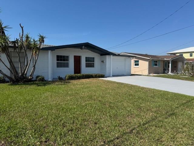 This Home had NO flooding two years ago, High and Dry. Waterfront Property. Bring your Boat.Two Bedrooms, One Full Bath, and a Half bath in garage. Very Large Garage.Canal in your Backyard.
