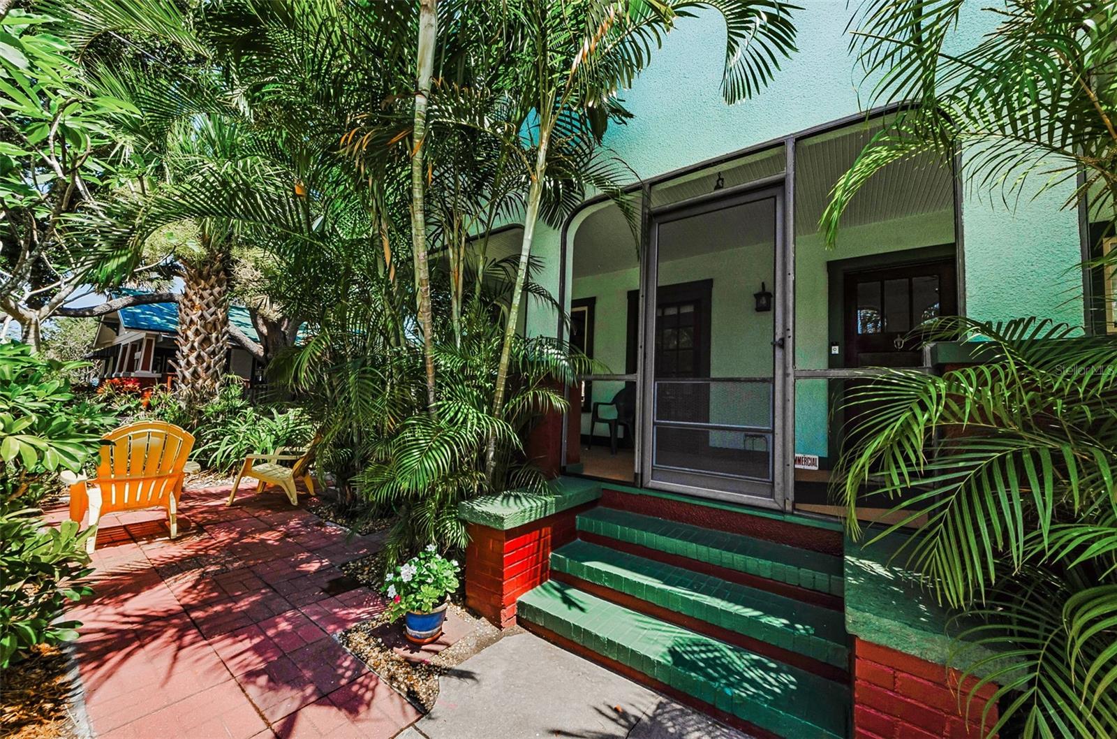 Downtown core classification. Location location. Use as a primary residence or vacation home within a short distance to everything Dunedin has to share, or use as a small downtown office, shop, gift store, or use for other future commercial development. The site could be developed as one elevated multistory single family home.  Development requirements to be verified with the City of Dunedin, depending on design.  New construction height limit 36 ft., with City approval. This existing 1925 historic house is a charming one story stucco craftsman bungalow with 2 b, 2 b, 1 c, updated kitchen, and bathrooms, a newer roof, and original antique heart-of-pine floors, a wood burning fireplace, many original large windows, and with a large open front porch with beautiful water views of St Joseph’s Sound across Edgewater Park & the City of Dunedin Marina. The rear yard is a fenced landscaped private courtyard garden patio area with table, chairs & umbrella. Open parking for 4 cars. Tropical plantings such as yellow frangipani, and red, pink & yellow hibiscus, and pink azaleas are in front & back yards. All of downtown Dunedin is at your disposal, with shops, restaurants, breweries, ice cream shops, gift stores, Edgewater Park, the marina, historic waterfront neighborhoods, and the Pinellas Trail. Enjoy the baseball games at T D Park as Dunedin houses the Toronto Blue Jays for spring training. Also nearby for spring training are the Phillies in Clearwater, the Yankees in Tampa. Also there are the Tampa Bay Rays in St Petersburg, Tampa Bay Bucs, and Tampa Bay Lighting Hockey Team. Tampa International Airport and Clearwater/ St Petersburg Airport are close by. Conveniently located and just steps to everything Dunedin has to showcase!