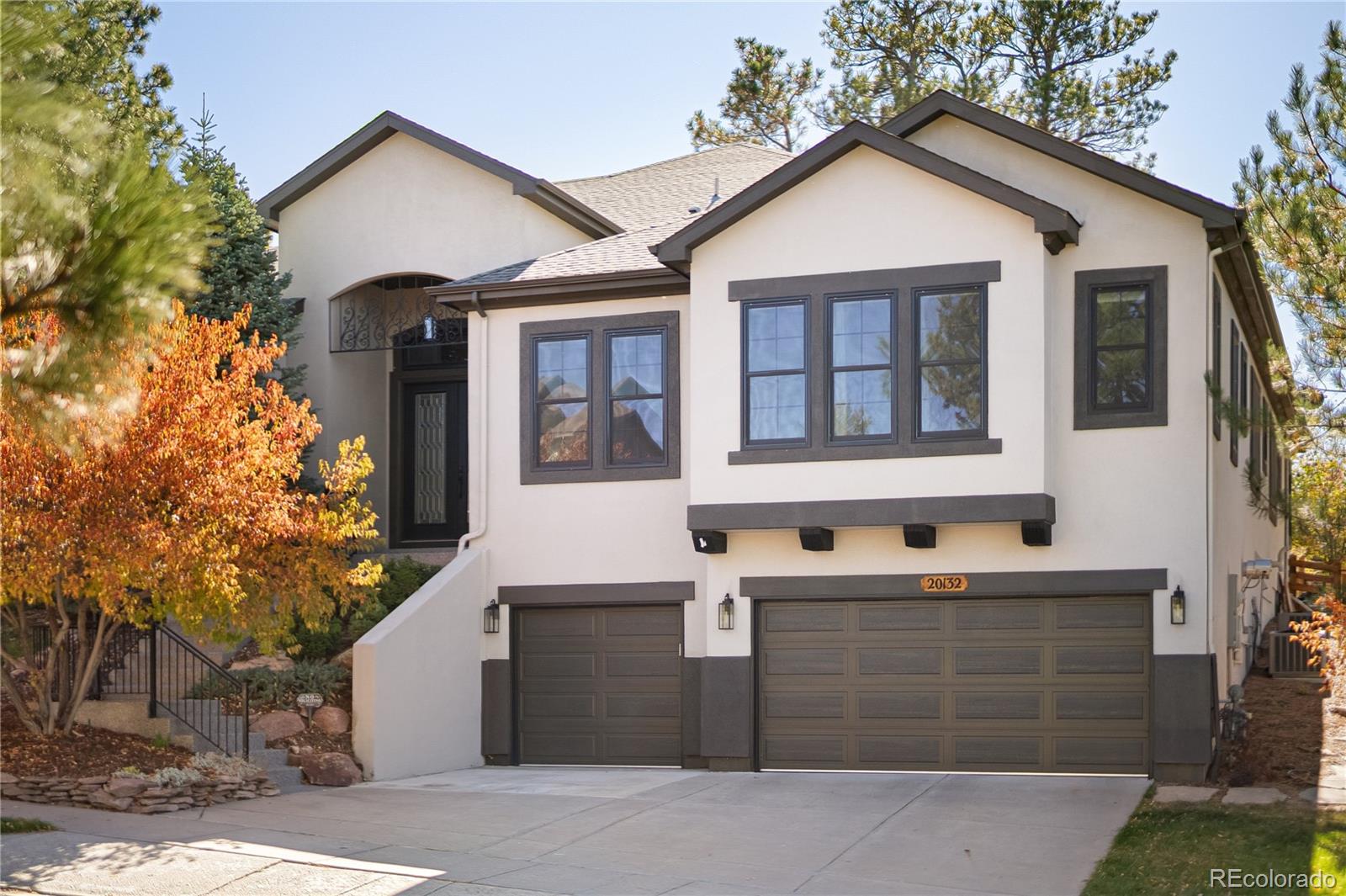 Welcome to your dream home in the peaceful Pine Bluffs neighborhood! This exceptional 4-bedroom, 5-bath estate offers the perfect balance of elegance, comfort, and functionality. With over 4,000 sq. ft. of single-level living plus an additional 2,000 sq. ft. of beautifully finished basement space, this home is designed to impress.

Step inside to soaring ceilings accented with rich stained wood, creating an immediate sense of grandeur. Surrounded by majestic pine trees and backing to a serene greenbelt, this property offers both privacy and convenience—just minutes from shopping, dining, and downtown Parker.

The grand foyer opens to a stunning open-concept layout anchored by three cozy fireplaces. Throughout the home, you’ll find all-new Andersen double-hung windows and new lighting, blending timeless craftsmanship with modern comfort.

The formal dining room sets the stage for elegant entertaining. Two sets of 8-foot French doors open to custom studies—perfect for remote work or creative pursuits. The chef’s kitchen features a spacious island, sub zero fridge, new dishwasher and a bright breakfast nook, ideal for both everyday living and special occasions. Step outside to a private patio retreat with a soothing water feature for ultimate relaxation.

Additional highlights include brand new fencing and backyard landscaping, new floors throughout the main level, brand new gym, electronic shades, a new LeafFilter gutter system, and a three-car garage with built-in cabinetry.

A third main-level bedroom also offers a private ensuite bath. The finished basement expands your living space with a fourth bedroom, game room, custom wet bar (with refrigerator, dishwasher, and microwave), home gym, and a spa-inspired bath featuring a massive steam shower with natural stone detailing.

Cap off your evenings with movie nights in the home theatre, complete with a striking stone fireplace—the perfect place to unwind.

Your dream home awaits!