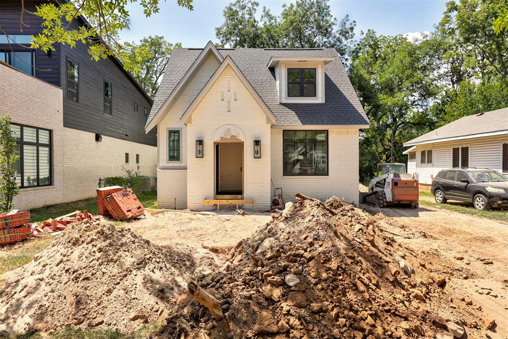 Experience the perfect blend of luxury, comfort, and convenience in this stunning new construction home located in the heart of the University of Oklahoma campus area. Designed with an open and airy floor plan, this home features a vaulted living room with soaring ceilings, abundant natural light from beautiful oversized windows, and a warm, inviting fireplace as the centerpiece of the space. The spacious kitchen offers ample cabinetry, designer finishes, and plenty of room for entertaining. The first-floor owner's retreat provides a private escape with a large walk-in closet and a beautifully appointed en-suite bath, while an additional bedroom and full bath downstairs offer flexibility for guests or a home office. Upstairs, you'll find three additional bedrooms and a large bonus room perfect for a game room, media room, or second living area. Offering a total of 5 bedrooms and 3 bathrooms, this thoughtfully designed home also includes a detached shop in the backyard for extra storage, hobbies, or workspace. Quality craftsmanship shines throughout with beautiful woodwork, custom cabinetry, and designer-selected finishes. Buyers still have time to personalize the home by selecting their paint colors. Estimated completion date is September 1st. Don't miss this opportunity to own a brand-new home in one of Norman's most desirable locations.