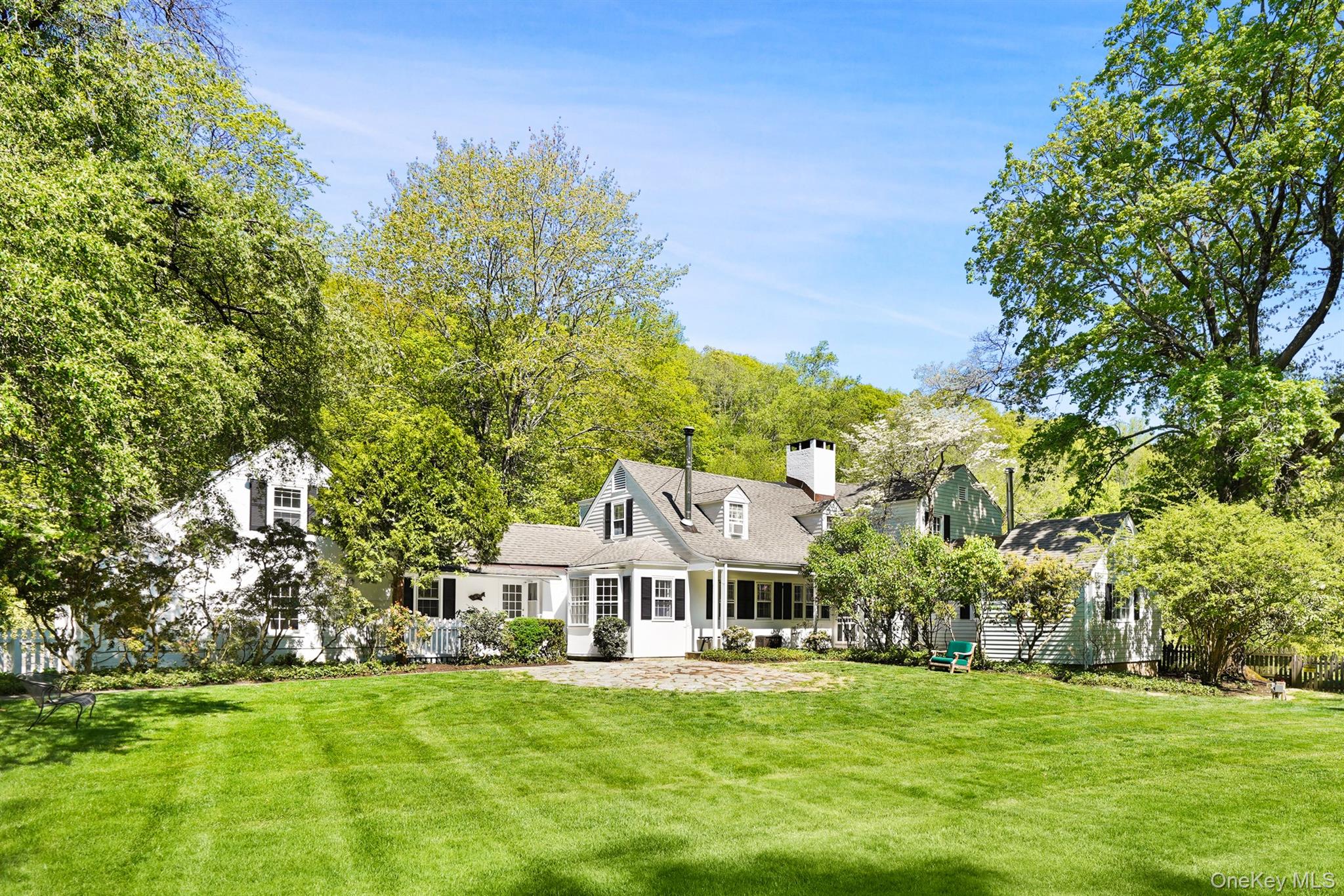 MIANUS FARM. First time listed in over 60 years! 1920’s Bedford Estate with a storied past. Located in an area of fine country homes and estates, over 22 peaceful acres. Truly picture book setting with two pristine ponds, gently rolling lawns, spectacular trees and flowering shrubs. Previously owned by Irene Mayer Selznick, wife of David O. Selznik, legendary film producer famous for creating "Gone with the Wind." Location for the blockbuster film “Fatal Attraction” starring then Bedford residents, Michael Douglas and Glenn Close. A spectacular offering with main house, caretaker’s cottage, barn and farm buildings. Swimming Pool overlooking the water. Rambling Country Farmhouse with nicely proportioned rooms, aged wood paneling, random width hardwood floors and four fireplaces. Sun-filled Living Room with fireplace. Open Dining Area with doors to stone terrace perfect four outdoor entertaining. Spacious Country Kitchen open to Family Room with wood burning stove. Library with aged wood paneling, fireplace and bay window overlooking the peaceful setting. Four Bedrooms include spacious first floor Primary Suite with woodburning stove.  Two Bedroom Caretaker’s Cottage. Barn Complex with Chicken Coop. Walk to the Mianus River Gorge. Serene setting yet a quick drive to shops, restaurants, commuting arteries and the Metro-North train. Easy access to Bedford Village, Greenwich and Stamford. A once in a lifetime opportunity to own part of Bedford’s rich past!