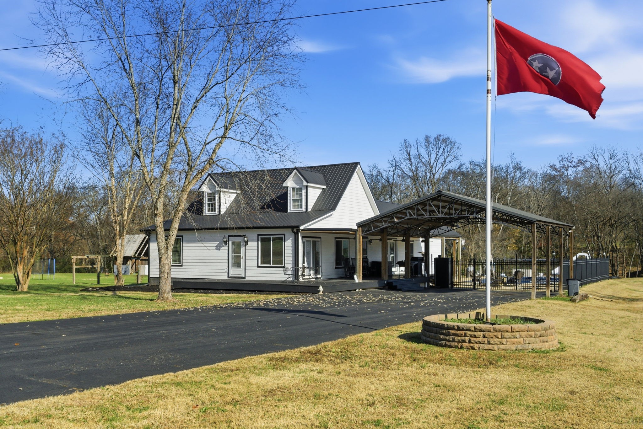 **Professional Aerial Pictures COMING SOON! (Weather delay)** This ranch style home provides 4 bedroom, 3 bath home offers 2,123 sq ft of living space on 5.59+/- acres of serene countryside. Enjoy spacious, light-filled interiors perfect for relaxing or entertaining. Step outside to your private oasis featuring an inground pool, covered porch, a 24x32 storage building/shed—ideal for hobbies, equipment, or a workshop and a barn located on the back of the property. The acreage provides room for gardening, play, or simply taking in the peaceful rural setting with a simple walk to the creek in your backyard. Conveniently located near I-24, this property blends country living with easy access to Nashville and Clarksville. Experience comfort, space, and true Tennessee charm.  — schedule your private showing today!OLD NUMERIC - 2825 Henry Gower Road // Buildings Info - Tool Shop / 24x32 with 200 amp separate service with water and attached 16ft lean-to off building / 40x60 Equipment shed with electric / 10x16 Storage building with electric / 24x50 4 stall barn.Home has a separate 400 amp service. Tankless Gas water heater, there is no lease for propane, client has the tank filled. 2021 renovations included addition with great room, 4th bedroom, full bath downstairs, covered back porch, new metal roof, new siding, laundry room, and primary bedroom closet and bath. Link to the specific siding is located in the document section.