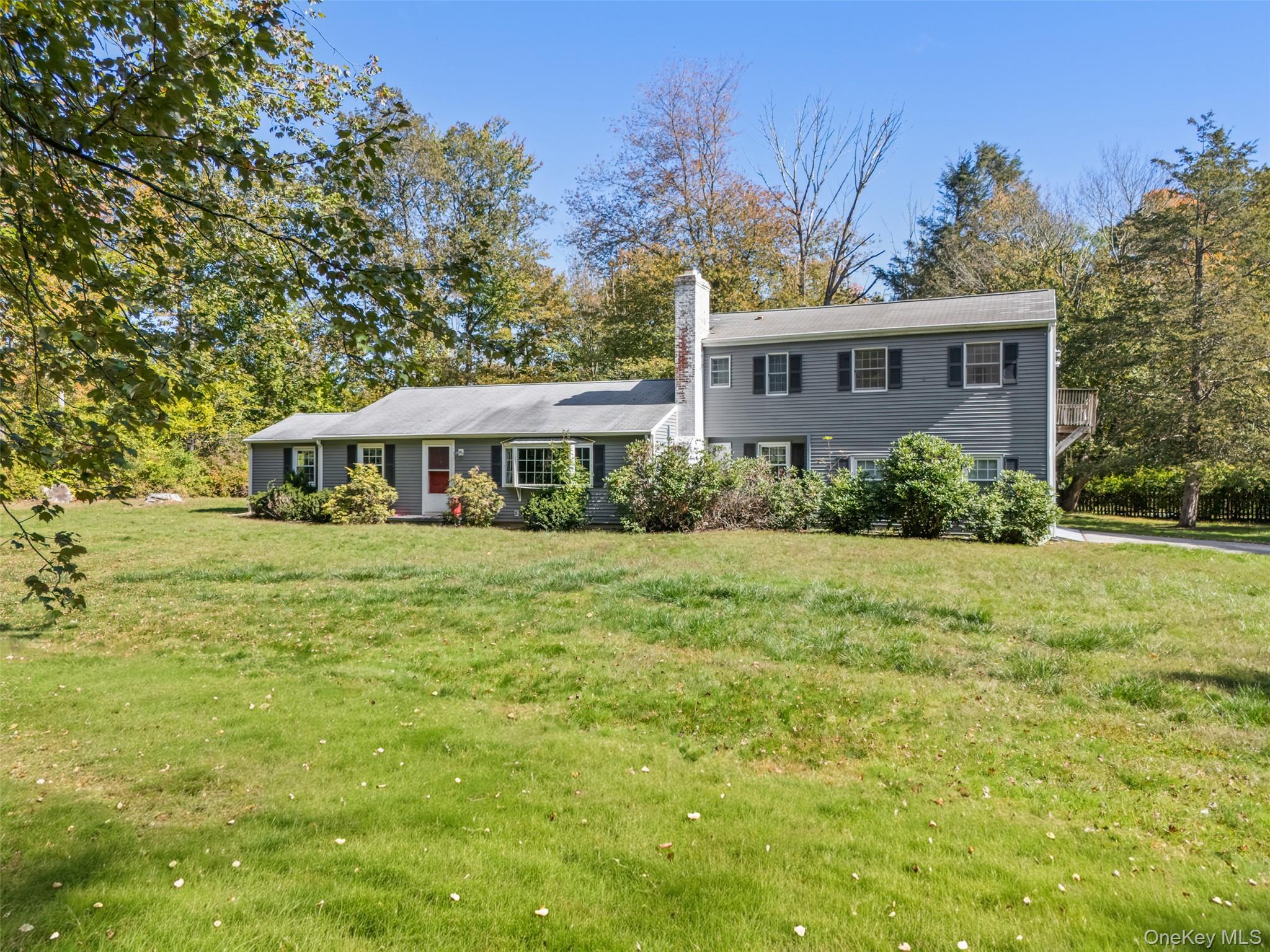 Western Views. Two park-like acres with level lawns, flowering plantings and towering Oak. First time listed in years, expanded country Ranch with hardwood floors and bay windows. Sun-filled Living Room with rustic pine paneling and fireplace. Dining Room with built-in hutch. Country Kitchen with breakfast area and door to Screened Porch. Three Bedrooms. Separate legal accessory apartment. Privately sited swimming pool. Most convenient location with easy access to Routes 123 and 35, Vista, Ridgefield and commuting arteries. A wonderful opportunity!