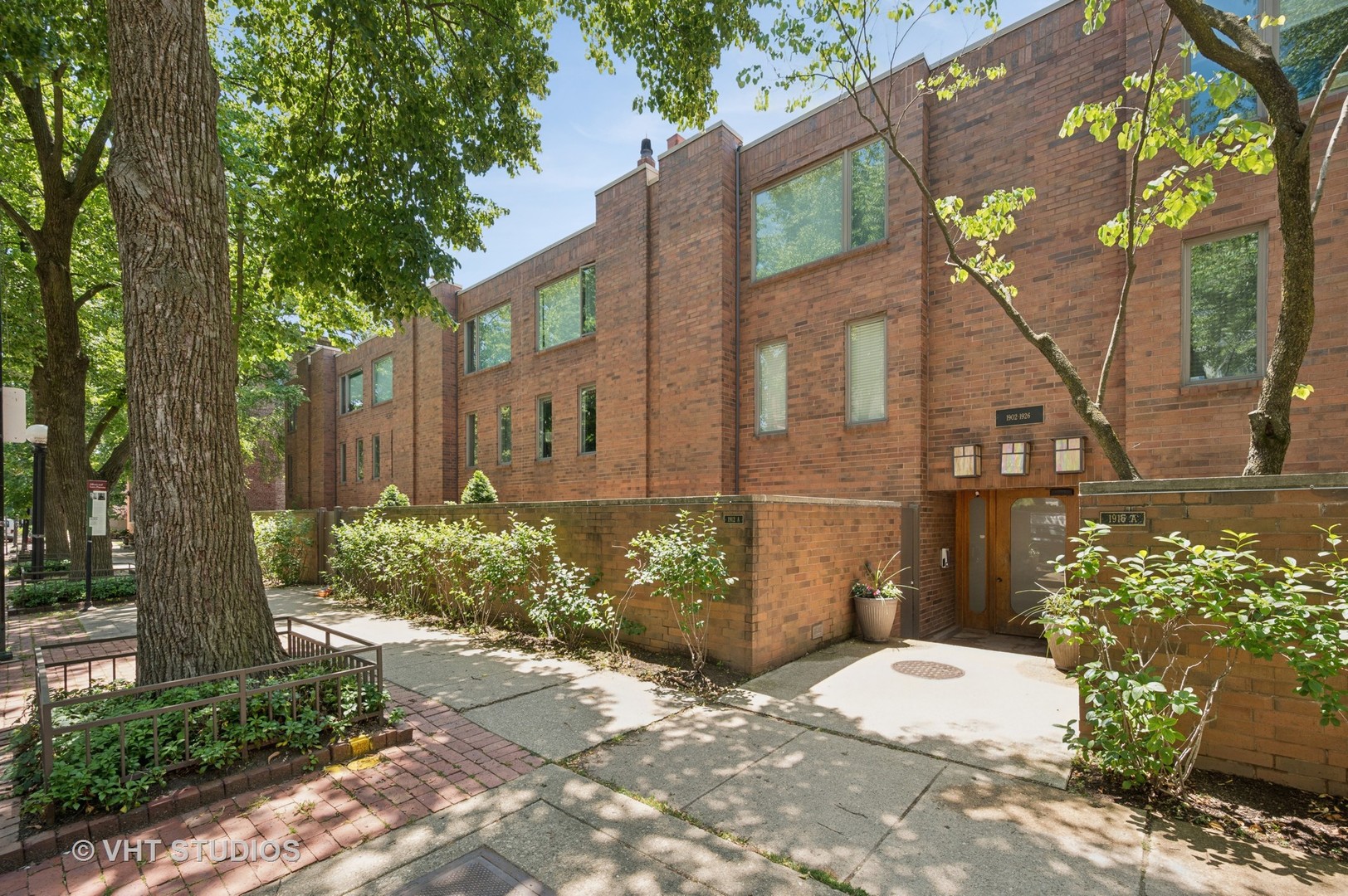 Prime East Lincoln Park location on a quiet, tree-lined street just half a block from Bauler Park, this well-maintained 3BR+ Den/2BA end-unit townhome with den offers space, comfort, and unbeatable walkability. The tri-level layout features hardwood flooring throughout the living area, bedrooms, and den, with two skylights on the upper level that brings in warmth and natural light. The inviting living room includes a wood-burning fireplace and opens to a south-facing 400 SF private brick patio/garden with its own entrance, pavers, and professional landscaping-perfect for relaxing or entertaining. The kitchen is both functional and spacious with granite countertops,  Bosch appliances, ample cabinetry, and back-to-back cabinets facing the dining area for added storage. Additional highlights include two full marble/ceramic bathrooms, generous closet space, in-unit laundry, exterior parking just outside the unit, and bike storage. Just steps to the Brown Line, Armitage shops, North Avenue Beach, Lincoln Park, Old Town, and top-rated restaurants, boutiques, and fitness studios. Located in the highly sought-after Lincoln Elementary School District.