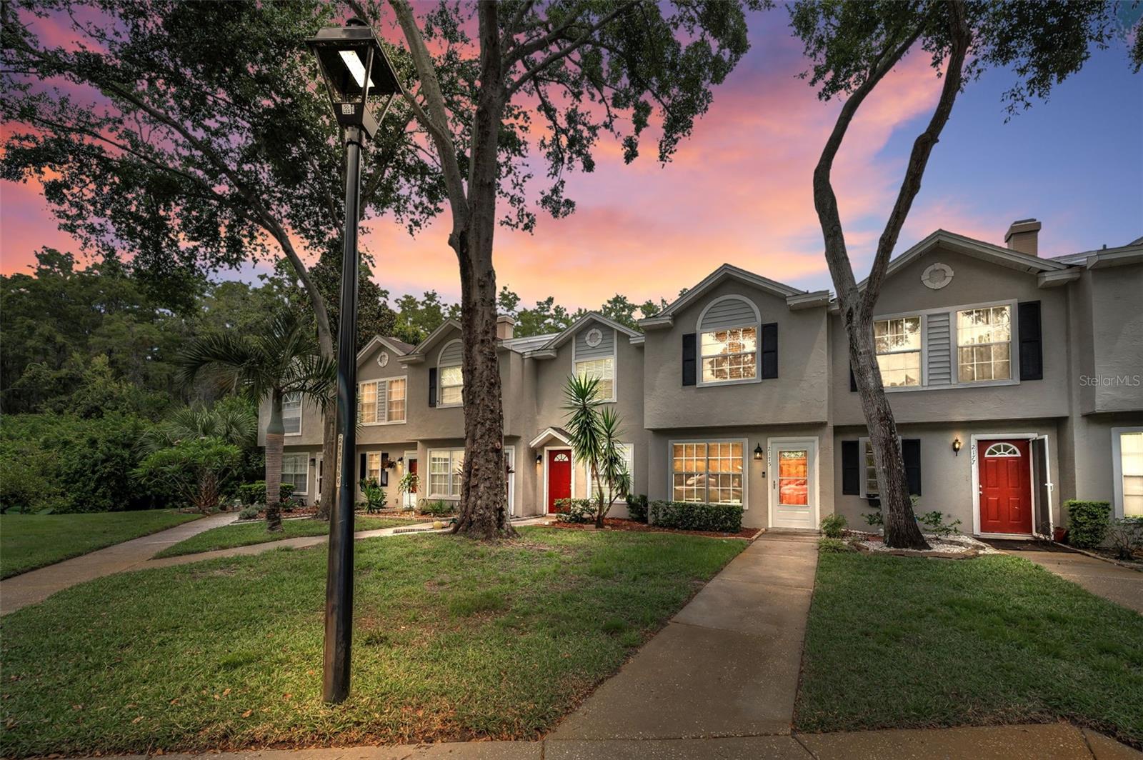 POPULAR FOX CHASE TOWNHOME.  2 Bedroom, 1 and 1/2 bath has recently been painted throughout.  NEW A/C 2025.  Newer Roof, replaced only a few years ago.  Zoned for Top rated Palm Harbor Schools and walking distance to the elementary school.  Downstairs features a living room/dining area  with luxury vinyl wood look flooring and there is accessibility to the half bathroom.  The light & bright  kitchen has been refreshed and includes NEW Stainless Steel appliances- range, refrigerator, dishwasher, microwave, and a snack bar.   Upstairs, both bedrooms are generous in size and have great closet space and share a full updated bathroom with a tub/shower combination. There's 2 extra closets in the loft area. Ceiling fans are in the bedrooms and living room. The french door (back) from the kitchen leads to the covered screened porch with views of lush green conservation.  The utility/laundry room is located off the screened porch with full size washer/dryer included. Assigned parking space near front of townhome and ample guest parking. Rent includes, grounds maintenance, trash, and the Community Amenites of Fox Chase including Community Pool, tennis courts, basketball, clubshouse, and playground. The community is in the process of finalizing installation of a gate at the entrance.  TERRIFIC LOCATION - Accessible to the Pinellas Trail. Dunedin & Tarpon beaches 20 minutes away and many parks nearby.  An abundance of shopping, medical offices, and hospital nearby.