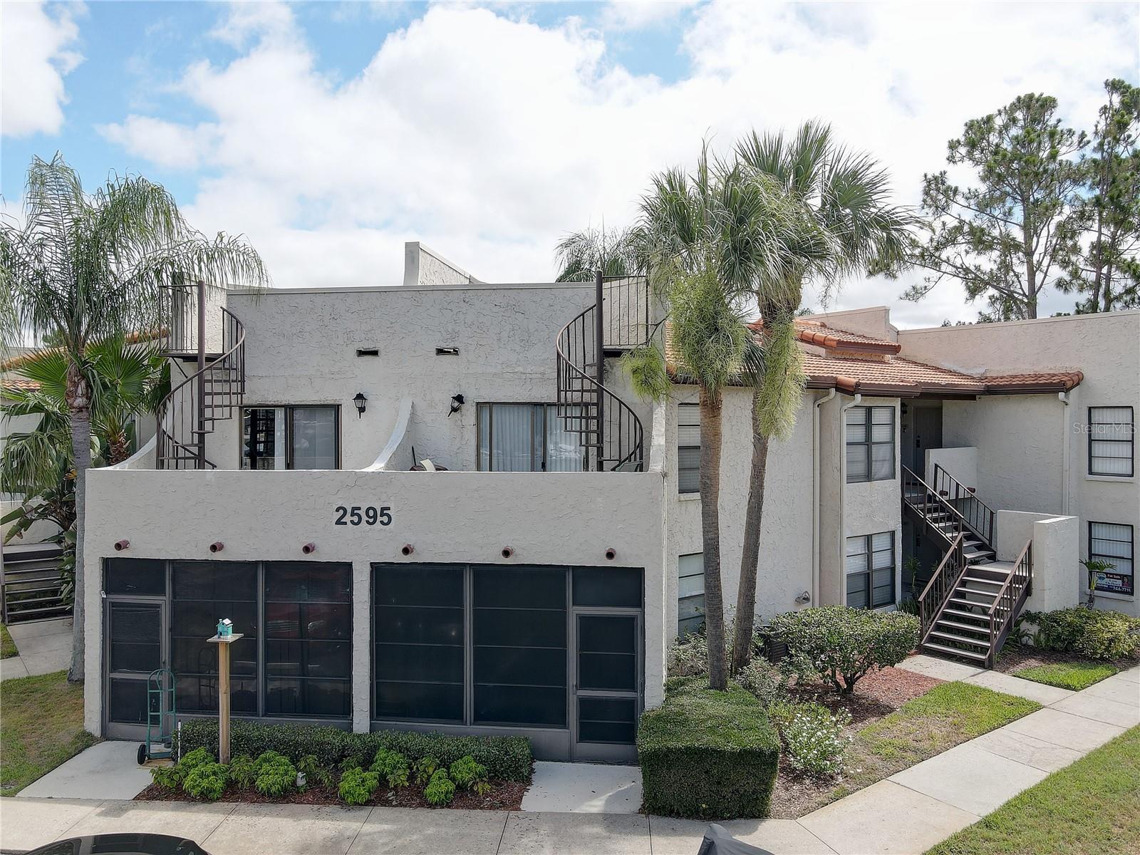 Welcome to Lake Tarpon Villas, a tranquil waterfront community set directly on a freshwater canal that leads straight into Lake Tarpon. This spacious second-floor, 2-bedroom, 2-bath condo delivers 975 square feet of open living, with vaulted ceilings that give the space extra breathing room, a large breakfast bar, and generously sized bedrooms.Two private patios overlook the water, and one even has its own staircase up to a private observation deck. Furnishings can remain if desired, making move-in even easier.This community allows Airbnb and VRBO rentals with zero restrictions, no waiting period, and both nightly and weekly stays permitted. Whether you're after a full-time home, a seasonal escape, or an investment that starts earning the moment you close, this unit is built to deliver.At just $475 a month, the HOA covers cable, internet, sewer, water, and trash. Residents also get a waterfront pool and heated spa, a clubhouse with kitchenette and game space, community boat docks, boat trailer storage, and a dedicated boat/car wash area.The location is top notch, minutes from award-winning Gulf beaches, championship golf, and standout shopping and dining, all while staying tucked into a quiet waterfront escape.This is turnkey waterfront living with real income potential. Schedule your private showing today and don't miss out!
