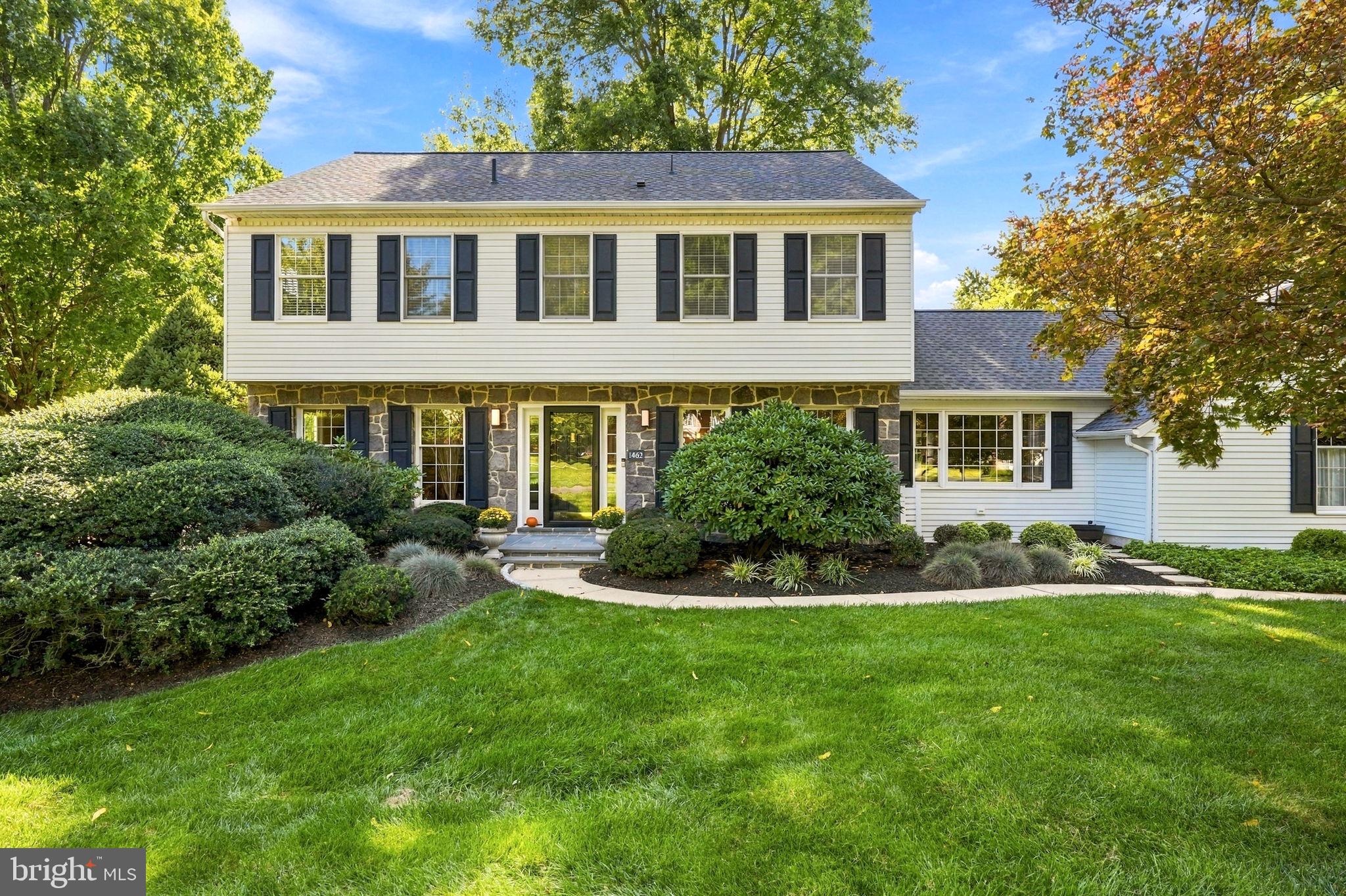 Welcome to 1462 Brandywine Lane, a meticulously maintained and exquisitely updated center hall Colonial in the coveted Green Hills neighborhood of Wayne. Perfectly situated at the end of a cul-de-sac in the top-ranked Tredyffrin-Easttown School District, this is an extraordinary home, the likes of which is rarely offered in the marketplace. The gracious center hall leads to the spacious living room, featuring beautiful hardwood floors and frosted French pocket doors that open to a perfectly situated home office. The heart of the home is the spectacular eat-in kitchen, offering granite countertops, a granite-topped center island with pendant lighting, custom American-built cabinetry, soft-close drawers, an extra-deep cutlery drawer, dual oven, display cabinetry, under-cabinet lighting and electrical outlets, subway tile backsplash and a substantial pantry with pull-out shelving. The kitchen opens to the dining room, featuring wainscoting and a custom built-in granite-topped buffet. Sliding glass doors with built-in mini blinds open to the low-maintenance deck overlooking the private rear grounds—the ideal spot for relaxing, entertaining, grilling and dining al fresco. Just off the kitchen is the spectacular family room, featuring a wall of custom-built bookshelves and cabinetry centered around a gas fireplace with a quartz surround. A custom wall-mounted cabinet beneath the TV provides convenient storage for entertainment equipment. French pocket doors open to the charming 4-season sunroom, featuring a tray ceiling and a doorway to the side yard. A tiled mudroom connects the home to the 2-car garage and provides access to a perfectly tucked-away powder room with a granite-topped vanity, as well as a nicely sized laundry room with storage cabinetry and a laundry tub. The 2nd floor of this very special home is where you will find the primary suite, featuring beautiful hardwood floors, 4 floating shelves and a walk-in closet with a custom flexible shelving system that can be reconfigured to suit your needs. The sumptuous owner’s bathroom offers a double-sink vanity, a beautifully tiled shower with a seamless glass door and a 3-panel lighted medicine cabinet with a magnifying mirror section. Three additional generously sized bedrooms are serviced by a beautifully updated hall bathroom with a double-sink vanity and tiled tub/shower combination. The finished lower level offers newer luxury vinyl flooring and provides a wonderful 2nd family room or recreation space. A separate carpeted area is perfectly suited for a home office, gaming area or exercise room. Two large storage rooms provide an abundance of additional storage. Beautiful hardwood floors throughout most of the home, recessed lighting, a whole-house vacuum system and extraordinary attention to detail all come together to make 1462 Brandywine Lane a very, very special place to call home. It may sound like a cliché, but this is truly a once-in-a-lifetime opportunity to own a perfectly designed home in a prime location, close to Wilson Farm Park, Valley Forge National Historical Park, the Gateway and King of Prussia shopping centers, and the shops, trains and restaurants of the Main Line. This is the one that you’ve been hoping would come on the market. Welcome home!