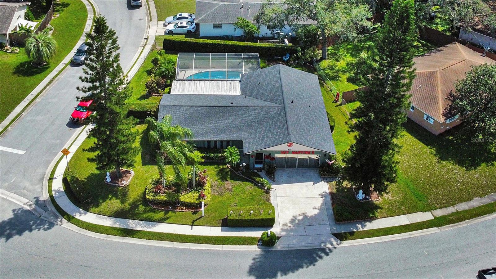 Welcome to this inviting 4-bedroom, 2-bath single-family home on a beautiful corner lot in Casselberry. With a brand-new roof (March 2025), screened-in pool, and well-maintained garden, this home is perfect for enjoying the Florida lifestyle year-round.

Inside, you’ll find a comfortable split floor plan that gives the primary suite added privacy, featuring a walk-in closet, private bathroom with a standing shower, and sliding doors with views of the pool. The second bedroom also offers a walk-in closet, while the third features an ample sliding-door closet. The fourth bedroom serves perfectly as a bonus space that can also function as a playroom, home office, gym, or game room. A convenient linen closet provides extra storage for everyday essentials.

The main living and dining areas are open and inviting, ideal for gatherings or relaxing evenings at home. The kitchen flows directly into the dining room and includes a breakfast bar with seating for casual meals or morning coffee, creating a great setup for entertaining and easy everyday living.

Step outside to your private oasis, an expansive covered porch overlooking the sparkling screened-in pool and beautifully landscaped yard. The pool has been well maintained, and the screen enclosure keeps it clean and ready to enjoy all year long. Surrounded by greenery, the backyard feels like a peaceful retreat for outdoor dining, lounging, or hosting family and friends. The second bathroom features double sinks, a tub/shower combination, and convenient direct access to the pool and porch area, making outdoor living easy and comfortable.

Appliances included are a range, microwave, refrigerator, dishwasher, extra refrigerator near the bonus room, washer, and dryer, along with a water softener system, providing everything you need for a smooth move-in.

Enjoy access to a welcoming community offering a clubhouse, swimming pool, kiddie pool, tennis courts, basketball court, and playgrounds.