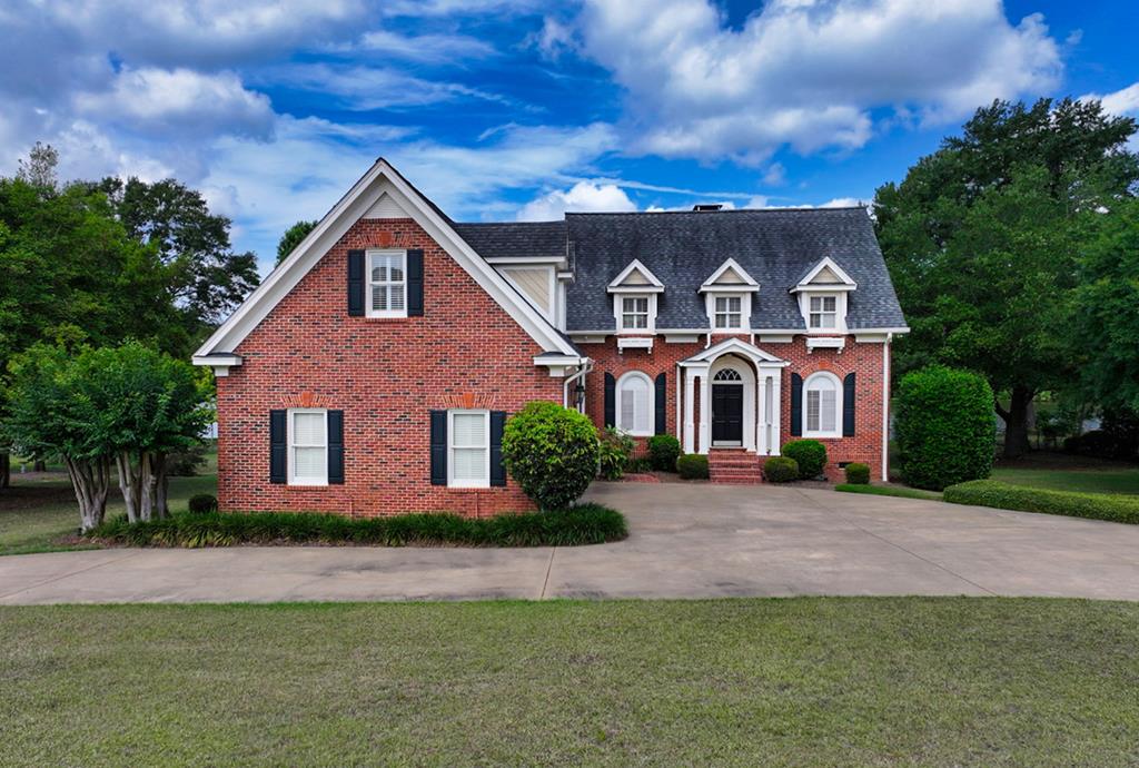 Welcome to your dream home on the tranquil shores of Lake Jenna, just steps from Tired Creek Golf Course in the heart of charming Cairo, Georgia. This stunning all-brick, traditional two-story residence offers elegant living space, blending timeless design with modern comforts. This masterpiece sits proudly above grade on a sprawling one-acre lot, complete with a circular drive and a carriage-entry garage. Step inside to discover a bright and airy interior, flooded with natural light through expansive windows and enhanced by sophisticated recessed lighting. The gourmet kitchen is a chef's delight, featuring unique blue-veined marble countertops, perfect for preparing meals while enjoying lake views. The formal living room exudes warmth with a fireplace flanked by built-in bookcases, creating an inviting space for gatherings. Downstairs, a spacious primary family room offers a cozy retreat with fireplace, built-in bookcases, and a charming seating nook off the kitchen and breakfast room. The second floor also boasts three generously sized bedrooms, a versatile flex space, and abundant storage closets, ensuring everyone has their own sanctuary. The master suite is peaceful, large-living, with ample space and serene views of Lake Jenna. Below the home, a large walk-in workshop provides endless possibilities for hobbies, storage, or a home gym. Outside, the expansive yard and brick-paved deck perched above the lake is perfect for family activities, from barbecues to playtime, all framed by the peaceful beauty of Lake Jenna. The home's traditional design shines with functional second-story roof dormers, adding character and charm to its brick exterior. Living in Cairo, Georgia, means embracing a laid-back lifestyle steeped in Southern hospitality. Enjoy welcoming neighbors, small-town charm, and the convenience of being just 15 minutes from vibrant Thomasville and 25 minutes from Tallahassee, Florida's bustling capital. Whether you're golfing at Tired Creek, exploring historic Thomasville, or commuting to Tallahassee, this location offers the best of both worlds—serenity and accessibility. This Lake Jenna gem is perfect for families craving space, luxury, and a connection to nature. Paddleboard, canoe or kayak on this 15-acre Lake and enjoy some beautiful scenery along the way. Schedule your private tour today and discover why this home is the epitome of Southern living! Lot: 1 acre Features: 4 bedrooms, 3.5 baths, gourmet kitchen, 2 fireplaces, workshop, circular drive, carriage-entry garage Check out the floor plan and virtual tour and walk thru this home in real time! Need a virtual showing? Just ask your agent!