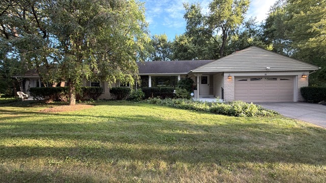 Great 4 bedroom ranch home with lakefront view. Private neighborhood beach with swimming and fishing right across the street. Newly renovated kitchen with quartz countertops, stainless steel appliances with newer hardwood floors in the kitchen, dining room, hallway and family room.    Spacious primary suite with private fireplace, vaulted ceilings, skylights, two walk-out patios in front and back of the bedroom, a large walk-in closet and private bath with double bowl sinks. Updated hallway  full bathroom with granite vanity top, whirlpool tub and a bidet system on the toilet. Renovated main level laundry room with front load washer and dryer, newer cabinets, utility sink, granite countertops and a wall mounted flat screen tv. Family room off the kitchen with access to the large screened in porch and deck. Two car garage with epoxy coating!! Large .9 acre lot with raised garden area, mature trees and professional landscaping. Rebuilt chimney! Recently rebuilt driveway with extra side parking! Ring security system! Large basement with 4th bedroom, recreation room and separate storage room. Lots of storage!!