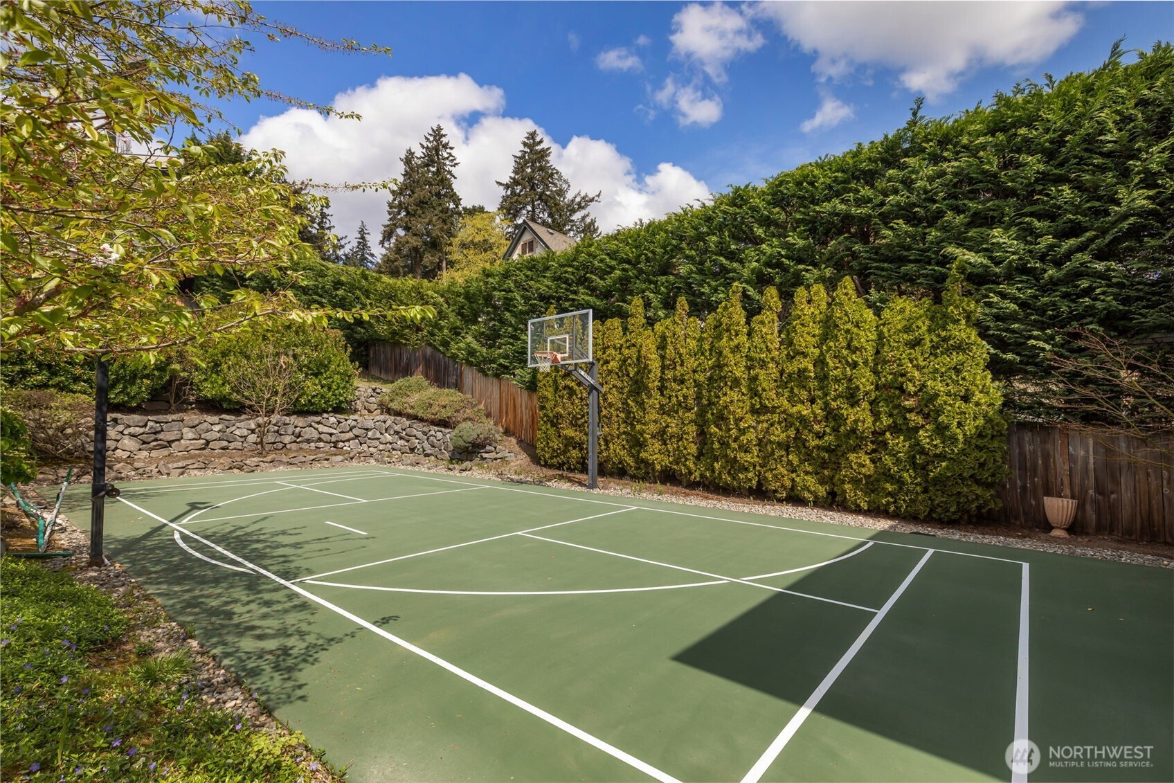 Experience the pinnacle of beachfront living in this architectural masterpiece. Designed to harmonize with the serene tranquility of Juanita Bay, this home offers a front-row seat to spectacular, unobstructed views of Mt. Rainier. Massive walls of windows flood the living spaces with natural light, blurring the line between the indoors and the shimmering lake. high-end culinary suite designed to inspire the most discerning chefs. Rich, substantial finishes and a palette of warm camel hues create an atmosphere of effortless, natural elegance. The space over the garage includes two guest bedrooms and a kitchen with a dedicated dining area. New A/C replaced in 2020. Dock resurfaced in 2022 with permit. Installed Golden lift with 48" of range and new canopy in 2022. Whole room new painting in 2026. This isn't just a home; it's a private resort. Every detail has been curated for a lifestyle of leisure and convenience: