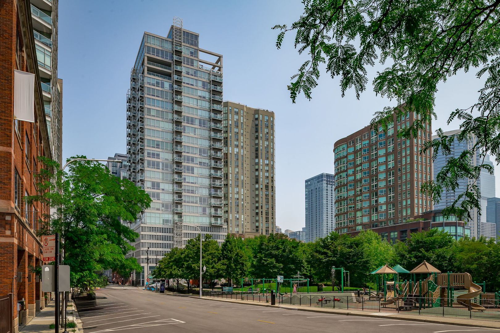 Live above it all in this stunning, move-in ready 2 Bedroom 2 Bath northeast-facing corner residence in the iconic Lucien Lagrange designed glass and steel building - Kingsbury on the Park. This high-floor premier tier, is wrapped in floor-to-ceiling windows, flooding the space with natural light and showcasing panoramic city views from every room. Enjoy an oversized private balcony, ideal for relaxing or entertaining against the backdrop of Chicago's world-famous skyline. Beautifully updated split-bedroom layout features a private entry foyer, in-unit washer and dryer and generous living and dining space. The kitchen features slate floors, stainless steel appliances, designer backsplash tile and floating breakfast island. Primary suite is a true retreat with a work-from-home nook, custom walk-in closet, and a spa-like bath with double vanity, deep soaking tub, and separate glass-enclosed shower. Additional highlights include custom window treatments, built-out closets and fresh paint throughout. Residents enjoy full-service amenities including a 24-hour door staff, fitness center, and on-site storage. Unbeatable location in River North with easy access to West Loop, Fulton Market, steps to East Bank Club, Montgomery Ward Park, the Riverwalk, CTA, expressways, and Chicago's top dining, shopping, and nightlife. Heated garage parking available for $35K must be sold with the unit. Investor friendly, professionally managed building with loads of recent improvements.