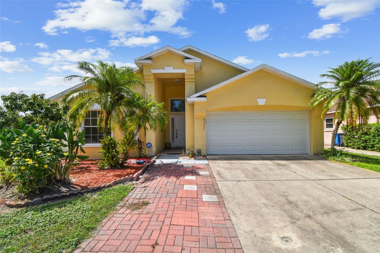 One or more photo(s) has been virtually staged. Welcome to the very desirable community of Charleston Corners in Tampa Florida!  This beautiful corner lot with water view home features 4 bedrooms, 3 bathrooms, 2 car garage, dining room, living room, breakfast area, and covered lanai with a huge screened room for your enjoyment.  NOT in a flood zone.  The spacious living room is great for gatherings and enjoying time with friends and family.  Vaulted Ceiling in almost every room.  Floor Tiles throughout the entire home.  This beautiful property is in a community with clubhouse, pool, tennis, and playground!  Mature fruit trees for the family to enjoy!  One of the best locations in Tampa with the best schools, close to shopping malls, supermarkets, pharmacies, beach and many more.  10-15 minutes to the Tampa International Airport.   Roof was replaced in 2016 and AC replaced in 2022 for a peace of mind.  Schedule your private tour today to learn more about this property!