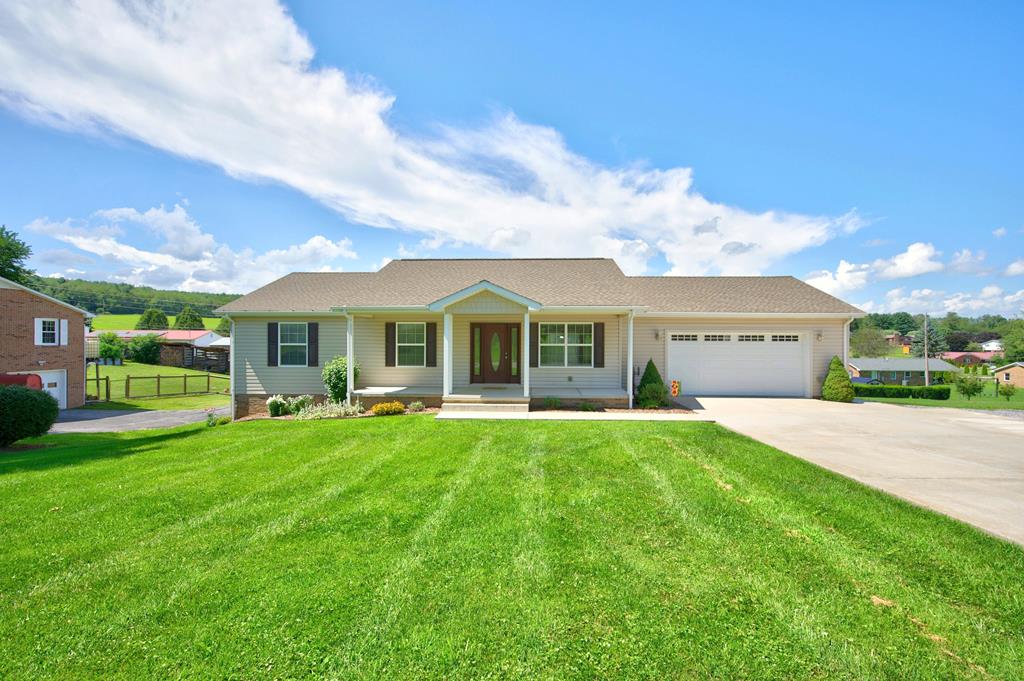 Welcome to this well-maintained, move-in-ready, 4-bedroom, 3-bath ranch home. The main level features three spacious bedrooms, including a comfortable primary master with an ensuite and a walk-in closet. There is also a full guest bath and convenient laundry room that has plenty of cabinetry for pantry use also. The open-concept living room and kitchen include laminate flooring, a cathedral ceiling, and special touches such as rounded corner walls and a lighted area at the ceiling to create a warm and inviting atmosphere. The kitchen has stainless steel appliances, a dinette and a breakfast bar for casual dining. Walkout to a back deck that looks out to a large yard with three outbuildings (one features electricity with its own dedicated breaker box) which could easily accommodate lawn care, gardening, hobby and recreational equipment. The lower level includes a finished bedroom, a kitchenette, and a common area which can accommodate open-concept dining and living space. There is a full bathroom accessible from both the bedroom and the common area, making this level ideal for family living, entertaining guests, multigenerational living or a mother-in-law suite. Major updates include an added natural gas line (2021), a high efficiency Trane furnace with heat pump (2021), a Generac generator (2021), a woodburning stove (2019), a supplemental gas heater (2019), added cabinetry in the laundry room (2022), a handicap shower in the downstairs bathroom (2019), a kitchenette in the lower level (2019), an insulated tool shed (2023) and new carpeting in the three main floor bedrooms (2026.) Situated on nearly an acre with an attached garage and large concrete driveway, this move-in-ready home offers the space, updates, and location you've been searching for! Don't miss your opportunity to call Sunset View in Rural Retreat home.