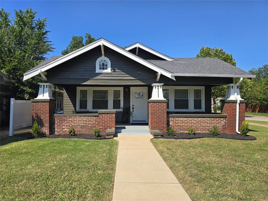Nestled in the heart of the vibrant Military Park neighborhood, just minutes from downtown Oklahoma City, this beautiful completely renovated historic home offers the perfect blend of classic charm and modern comfort. Thoughtfully updated throughout, the home features three spacious bedrooms—large enough for king-sized beds and all offer ample closet space and inviting, stylish decor. The refurbished open-concept layout creates an effortless flow from the living area to the modernized kitchen, which boasts a large island with barstool seating, stainless steel appliances, modernized cabinetry with granite countertops creating the ideal area for both casual meals and entertaining. Both custom renovated bathrooms are spacious, stylish and offer plenty of storage.  Outdoor living is just as enjoyable, with a charming front porch perfect for morning coffee and an expansive back patio made for evening relaxation. Privacy and peace of mind are built in, thanks to a fully fenced backyard and commercial grade security gate providing private gated parking. Plenty of space to add a carport for covered parking or a garage for additional vehicle protection, additional storage or other uses, ie workspace, home entertainment space or additional living areas, leaving ample backyard for pool, play and/or pets.  Other updates include professionally restored wood floors throughout, HVAC,  PEX plumbing lines, electrical lines, foam insulation under the entire house, and roof replaced in 2016. Whether you're looking for a forever home or an investment opportunity, this property is move-in ready and perfectly positioned in a neighborhood known for its energy, accessibility, and community feel. Experience the best of both worlds—historical character paired with modern upgrades—all just a stone’s throw from the heart of OKC.