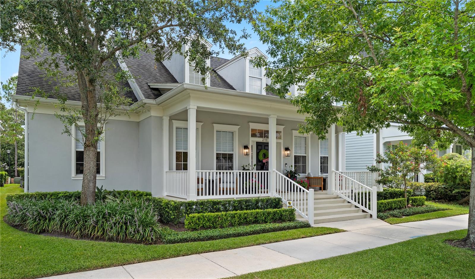 This beautifully updated 3 bedroom, 2.5 bath one-story David Weekley “Brames” model with coastal elevation offers refined design, spacious living, and a rare level of luxury in the highly sought-after Baldwin Park community. With a desirable split floorplan and custom upgrades throughout, this turnkey residence delivers effortless living and elevated style in one of Orlando’s premier neighborhoods.

Porcelain tile flooring runs seamlessly throughout the home, including the covered patio, and is complemented by elegant 8-inch baseboards and cove crown molding for a clean, architectural finish. At the heart of the home, the show-stopping kitchen features a dramatic quartz waterfall island, custom cabinetry with pull-out storage and hidden outlets, dual-zone wine refrigerators, and a premium Dacor appliance package—including a 48-inch gas range, custom vent hood, and 42-inch panel-front French door refrigerator.

The open-concept layout flows into the spacious family room, where 9-foot Nano accordion doors completely open to the covered patio, creating seamless indoor-outdoor living. Custom window treatments are installed throughout the home, with motorized Hunter Douglas shades in the main living areas offering both privacy and light control at the touch of a button.

The split bedroom layout ensures privacy, with the primary suite tucked away and offering a private patio entrance, spa-style bath with soaking tub, frameless glass walk-in shower with body spray jets, dual vanity with hidden-storage mirrors, and a fully built-out walk-in closet. On the opposite side of the home, two additional bedrooms include custom closets and designer window treatments, and share a beautifully updated full guest bath. A flexible den is located between the two secondary bedrooms, offering the perfect space for a home office, media lounge, or playroom. A stylish half bath is conveniently positioned near the kitchen and family room for guests.

Outdoors, enjoy a fully tiled covered patio, a brand-new spa to relax in, lush landscaping with new sod and irrigation, and a rare and sought-after three-car garage featuring epoxy floors, built-in cabinetry, and overhead storage. Located within a few blocks of the community’s pools and playgrounds, and just steps from the Cady Way Trail, this exceptional residence offers luxury living, a functional layout, and access to one of Central Florida’s most vibrant and well-connected communities.